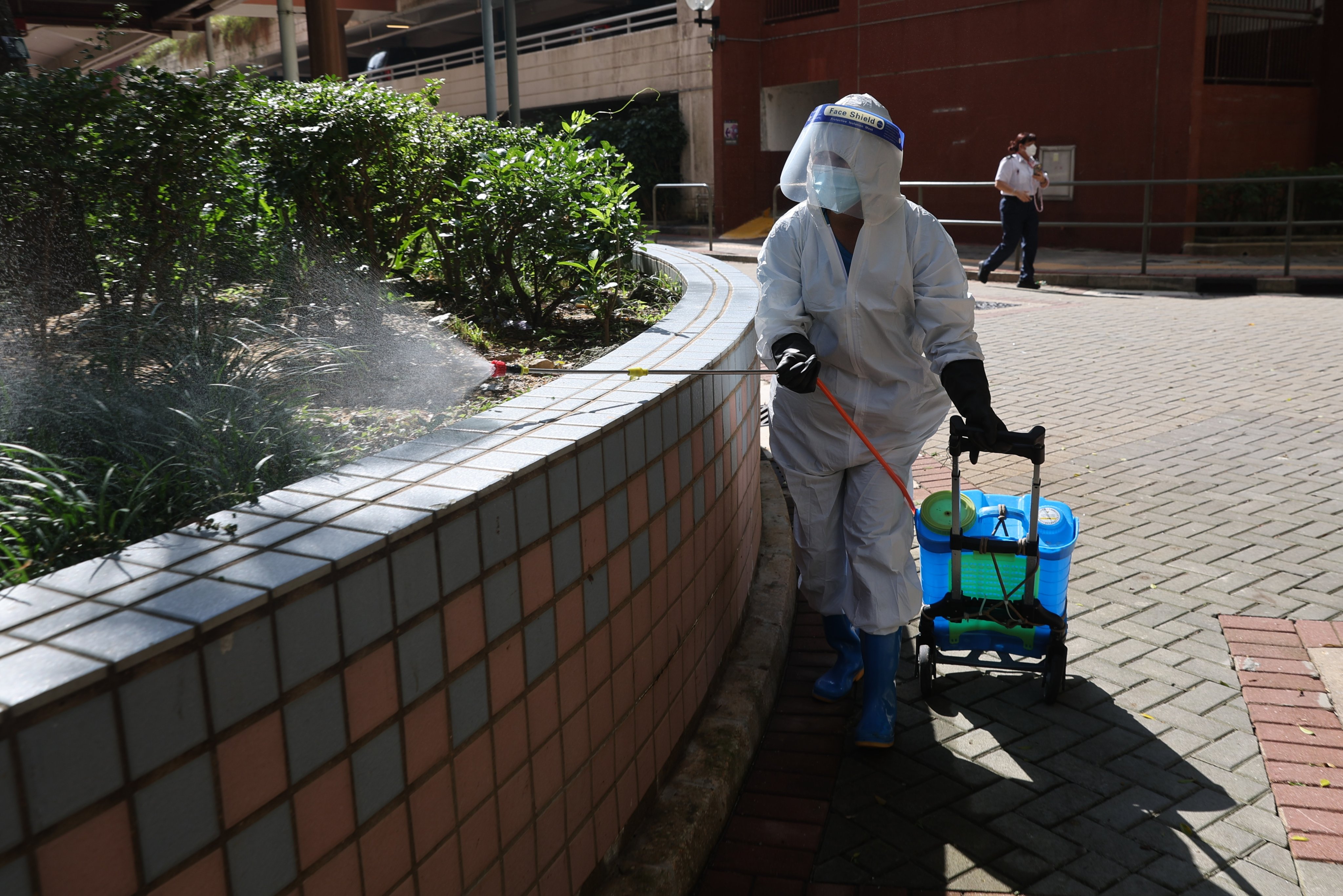 Workers carry out mosquito control at Shek Lei (I) Estate, where a woman has been infected with Chikungunya fever.  Photo: Edmond So