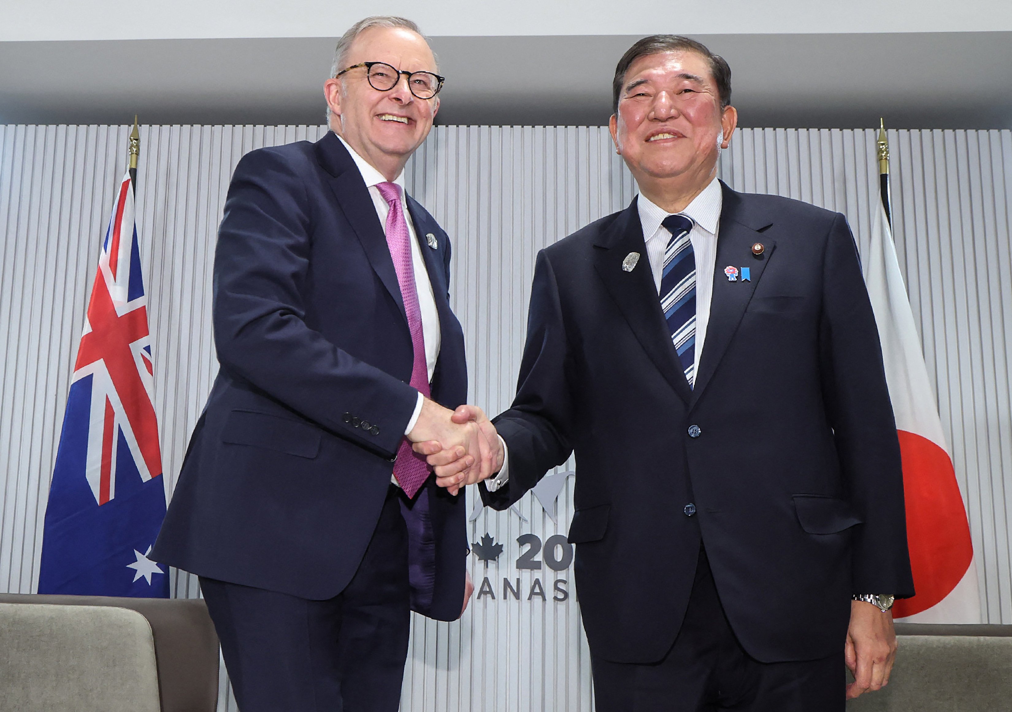 Australia’s Prime Minister Anthony Albanese (left) shakes hands with his Japanese counterpart Shigeru Ishiba during a meeting on the sidelines of the G7 Summit in June. Photo: Jiji Press / AFP