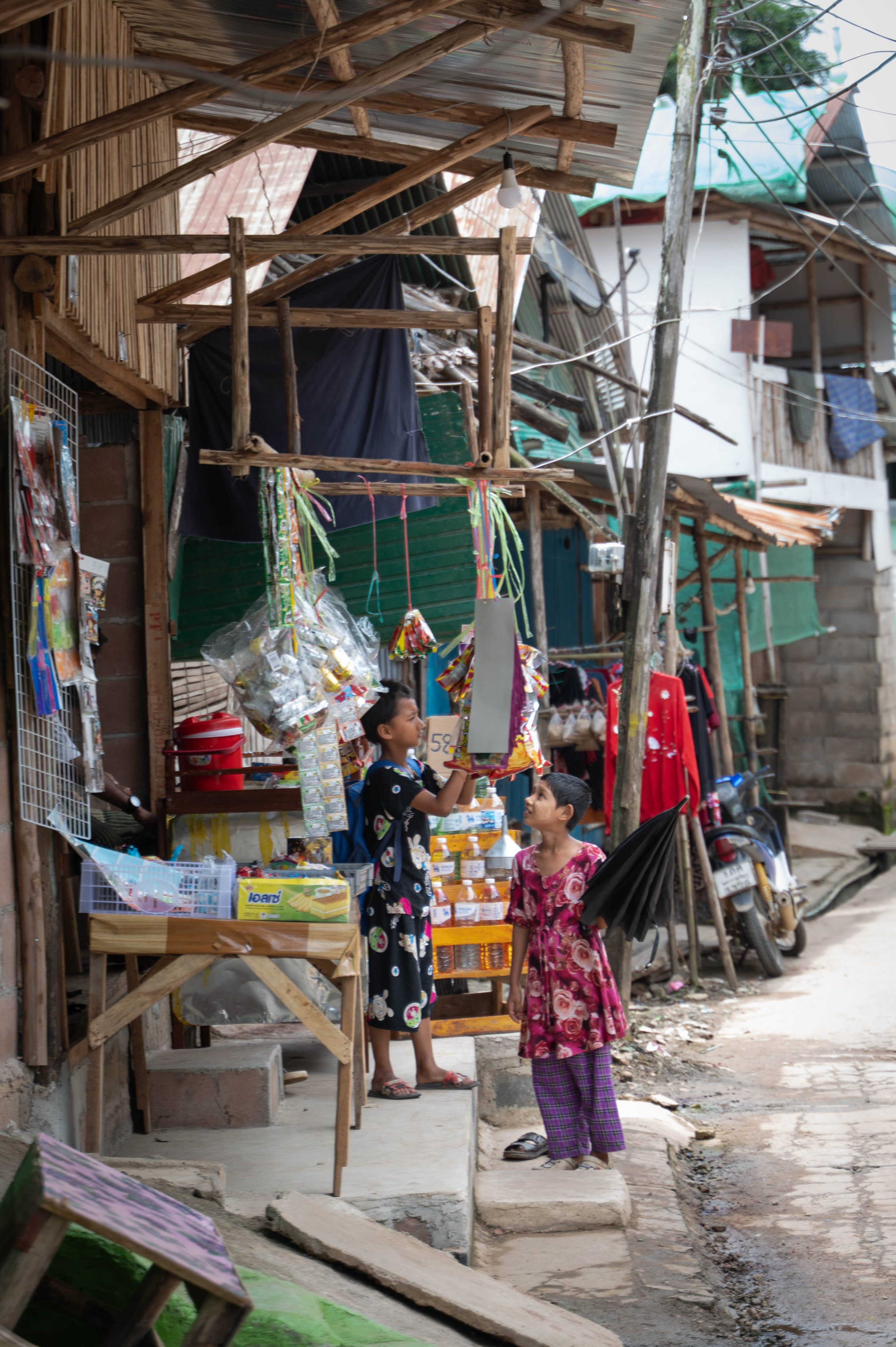 Young children browse for snacks at a provision shop in Mae La Camp on August 5. Photo: Janelle Ling