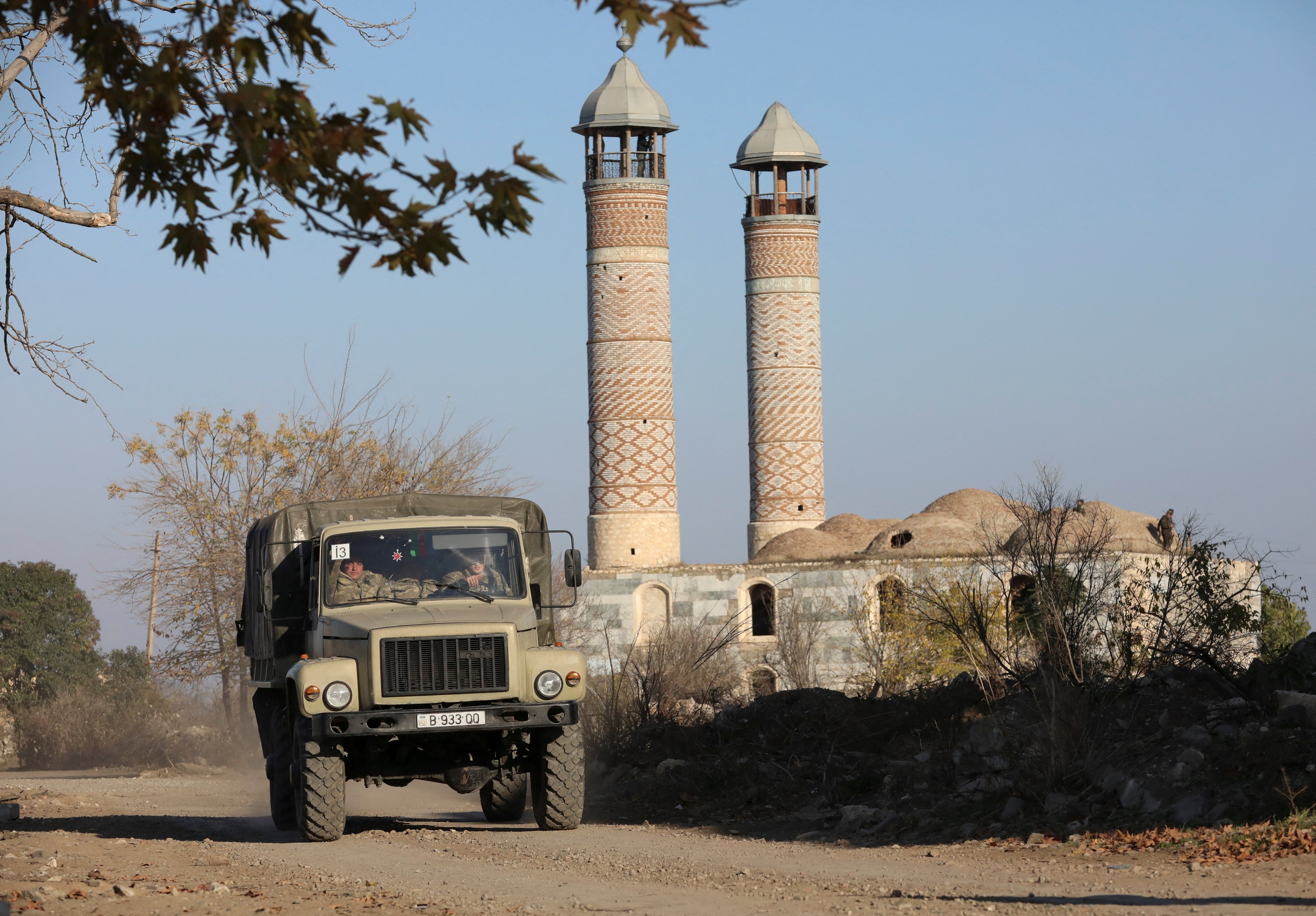 Azerbaijani soldiers drive a truck near a mosque in Agdam in the Karabakh region in 2020. Photo: Reuters