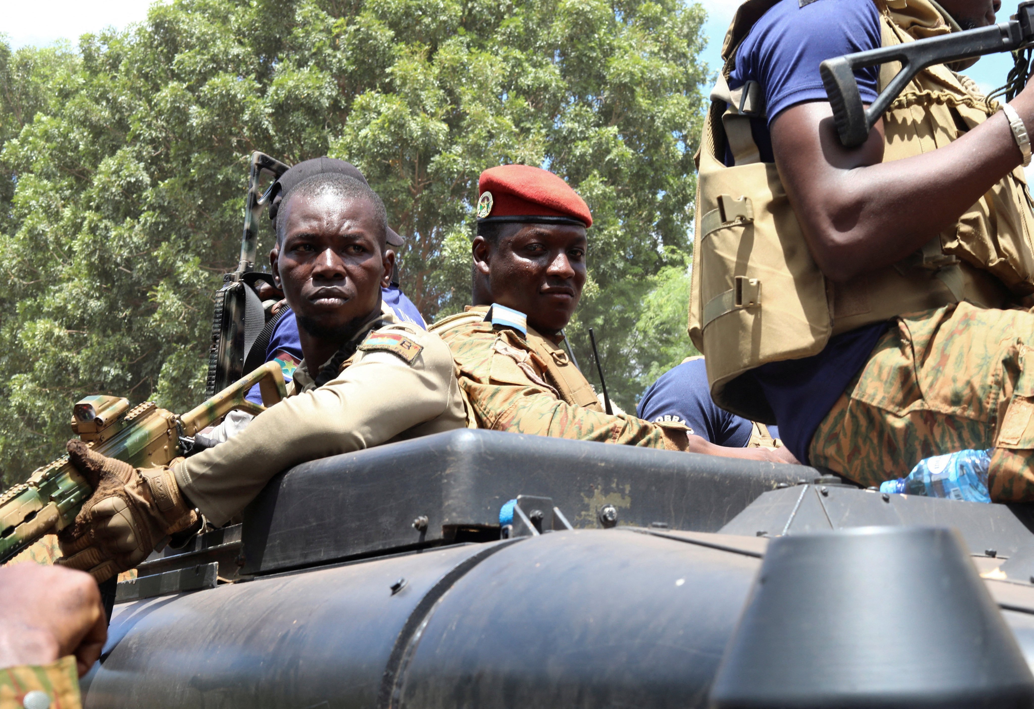 Burkina Faso’s military leader Ibrahim Traoré is escorted by soldiers while he stands in an armoured vehicle in Ouagadougou in October 2022. Photo: Reuters