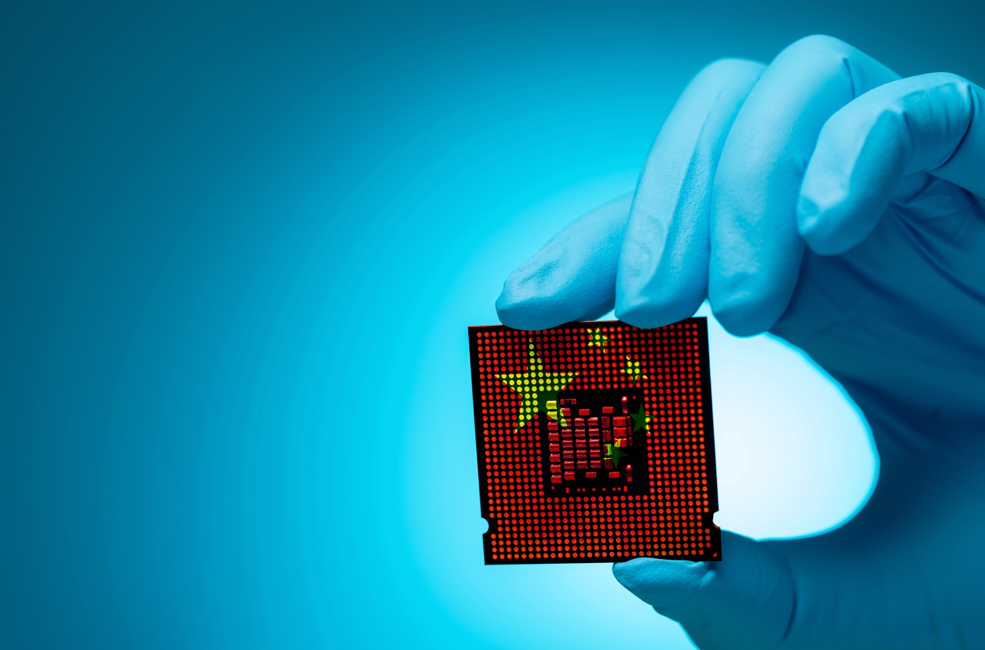 Electronic engineer holding computer chip with Chinese flag design. Photo: Shutterstock Images