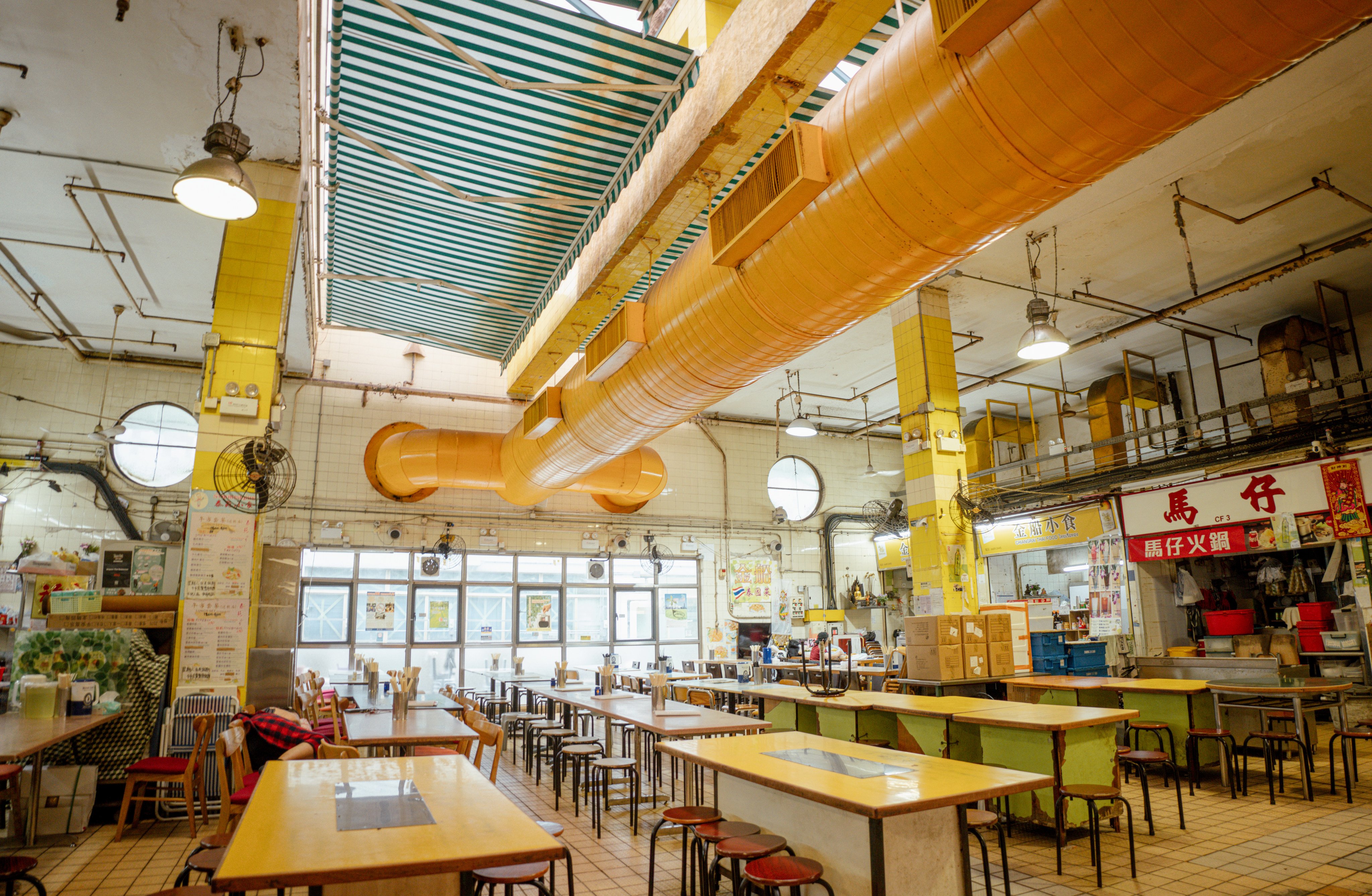 Exposed pipes and ducts inside the cooked food market in the Kowloon City Municipal Services Building. Photo: Alexander Mak