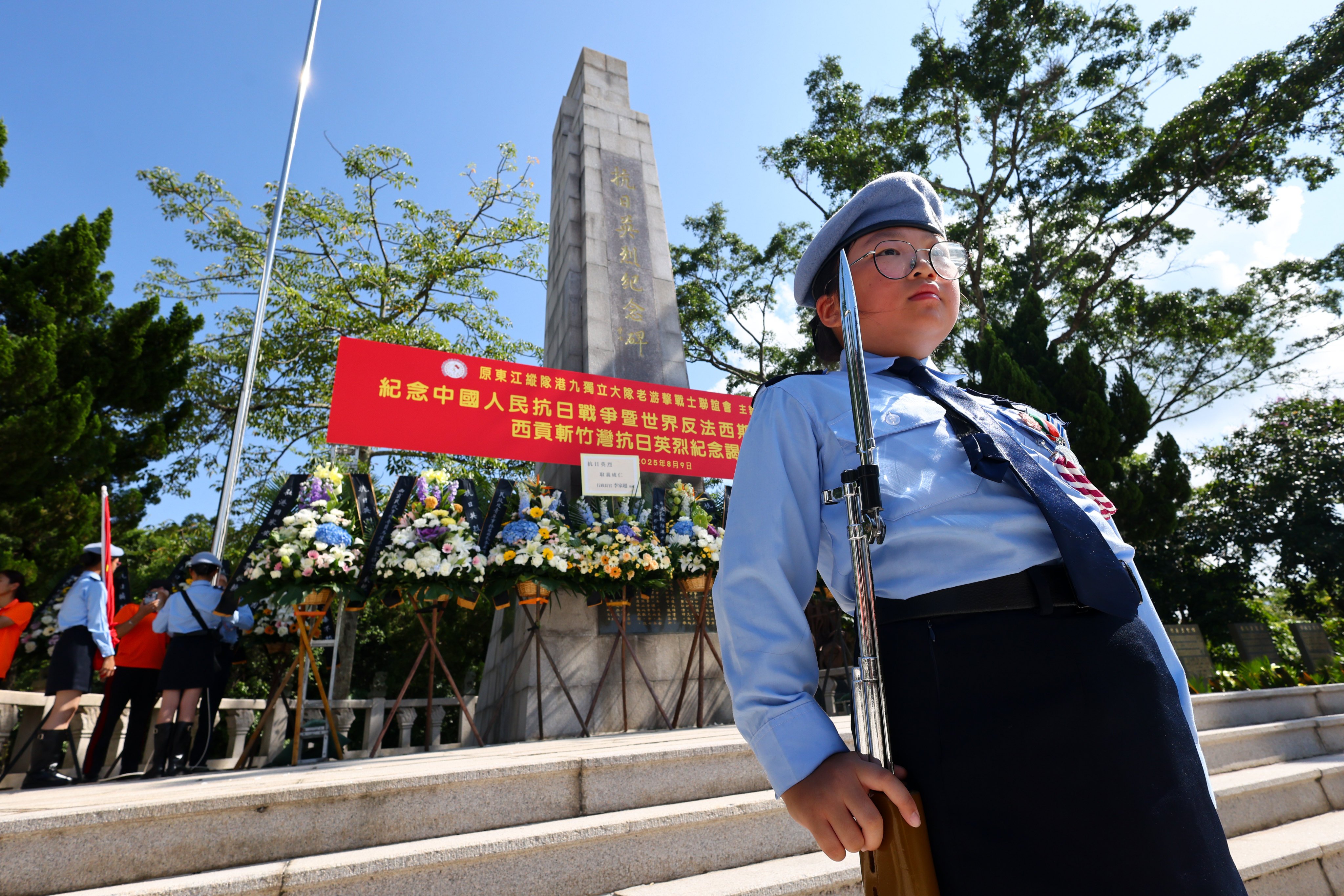 A wreath-laying ceremony is performed on August 9 at a monument in Sai Kung to pay tribute to those who died in the war of resistance against the Japanese. Photo: Dickson Lee