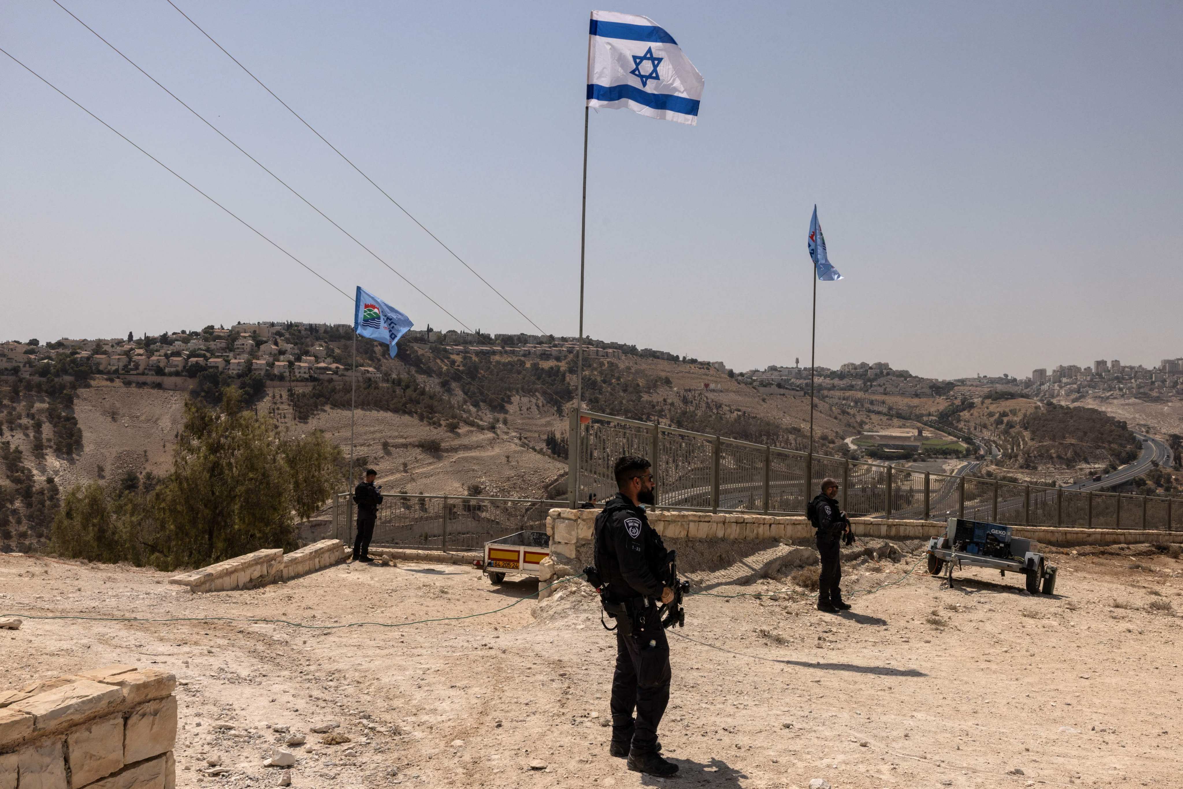 Israeli policemen stand guard near the settlement of Maale Adummim, in a land corridor known as E1, outside Jerusalem in the occupied West Bank on August 14. Photo: AFP