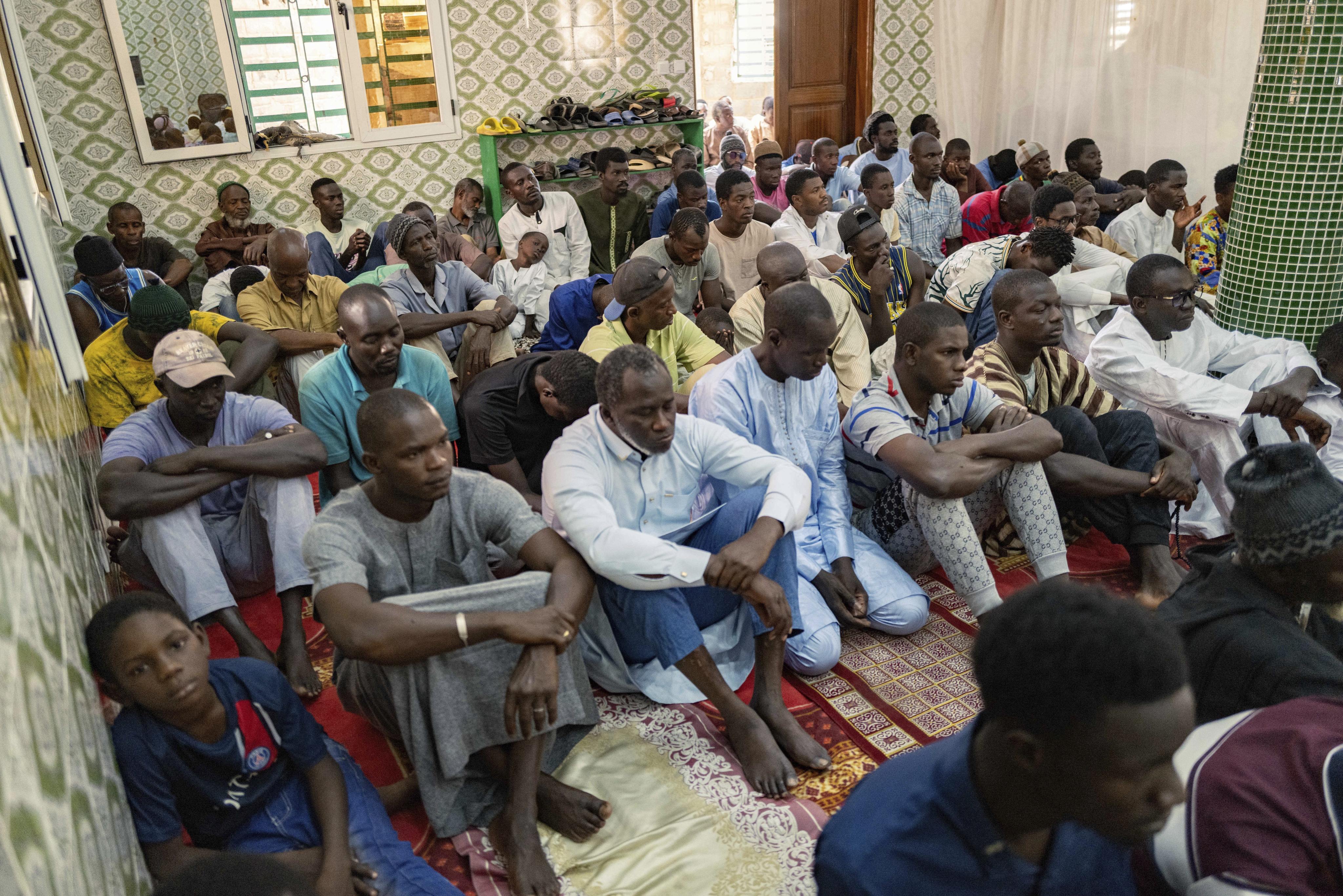 Worshippers listen to Imam Ibrahima Diane, an advocate for gender equality, deliver a sermon at a mosque in Dakar, Senegal, in July. Photo: AP