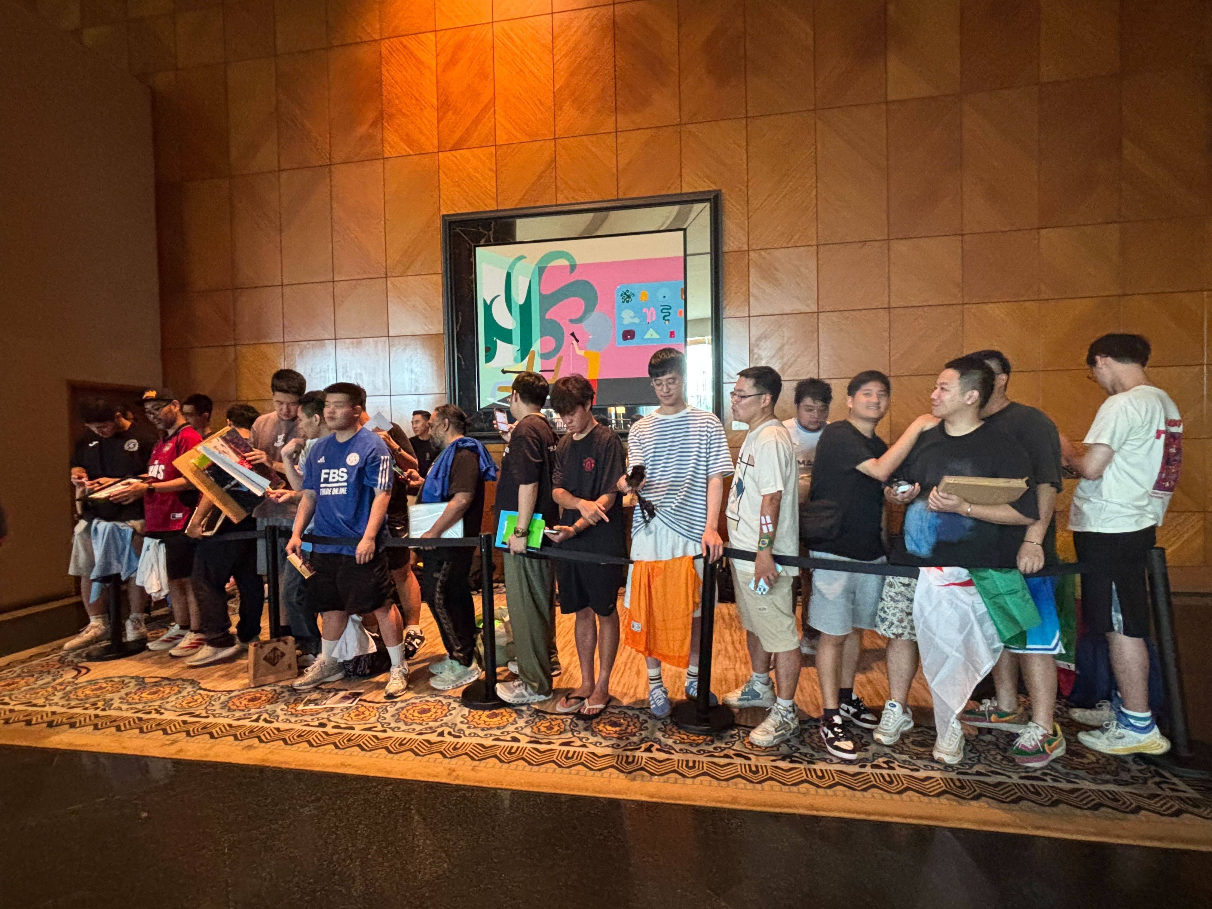 Supporters at the Grand Hyatt Hotel in Wan Chai gather as they wait for the Al-Ahli players to arrive