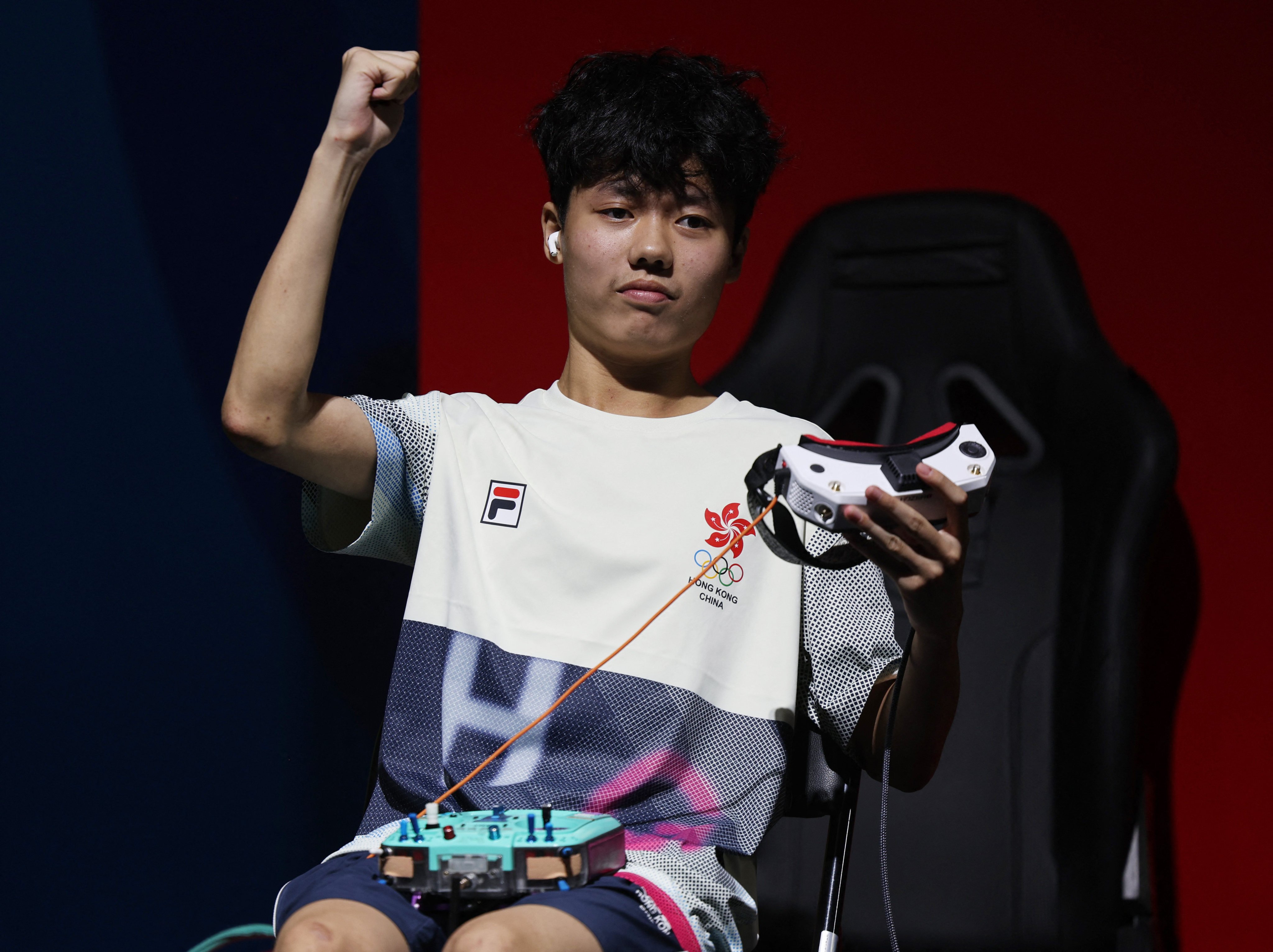 Hong Kong’s Kwan Chun-yan celebrates after finishing third in race one of the final. Photo: reuters