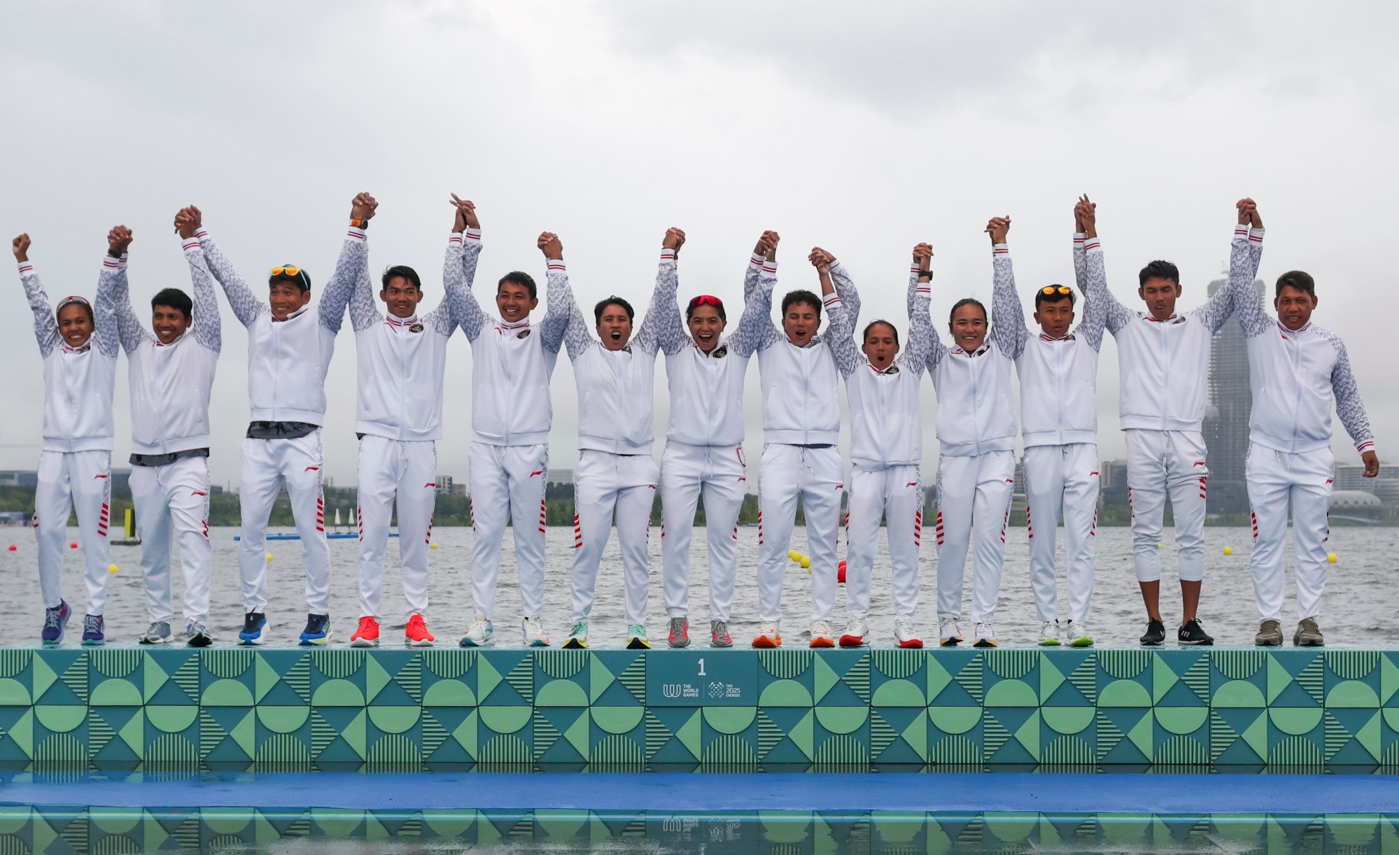 Indonesia celebrate victory in the open eight-seater 200m dragon boat event. Photo: Xinhua