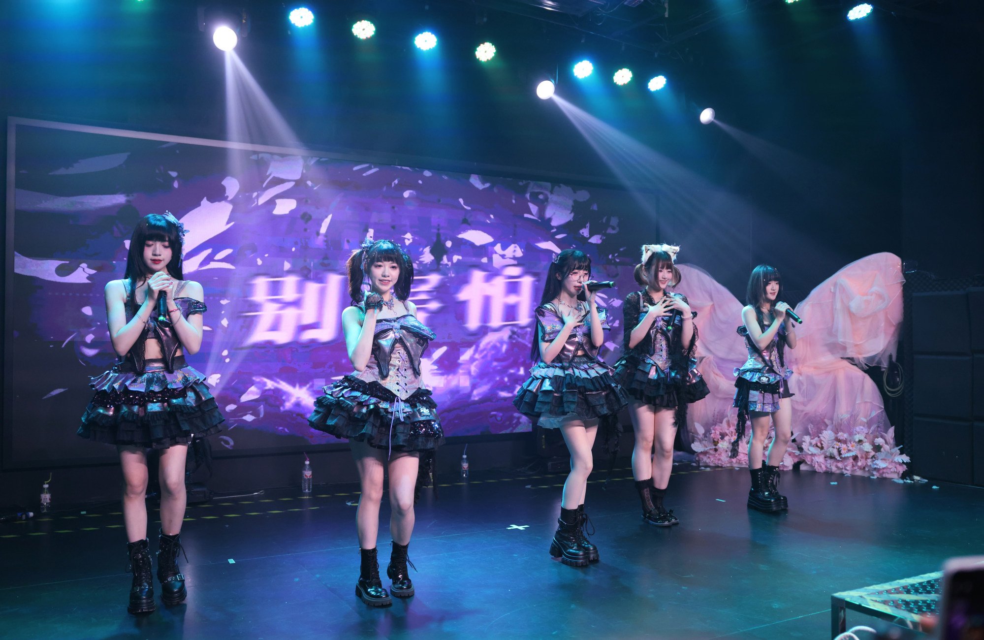 Chinese amateur girl group Affloret perform onstage.