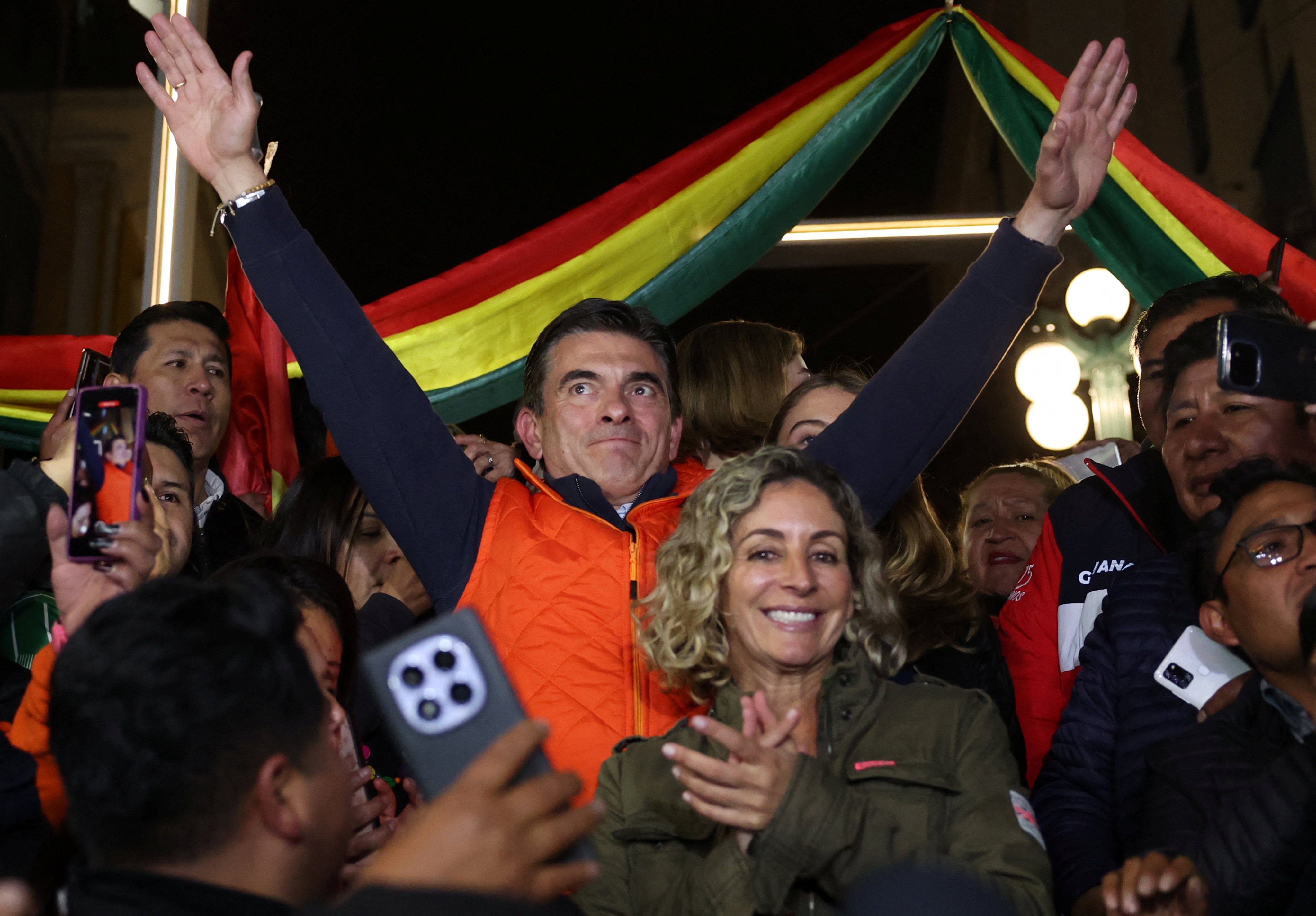 Bolivian presidential candidate Rodrigo Paz of the Christian Democratic Party, accompanied by wife Maria Elena Urquidi, reacts as early official results show that he is leading Sunday’s presidential race. Photo: Reuters