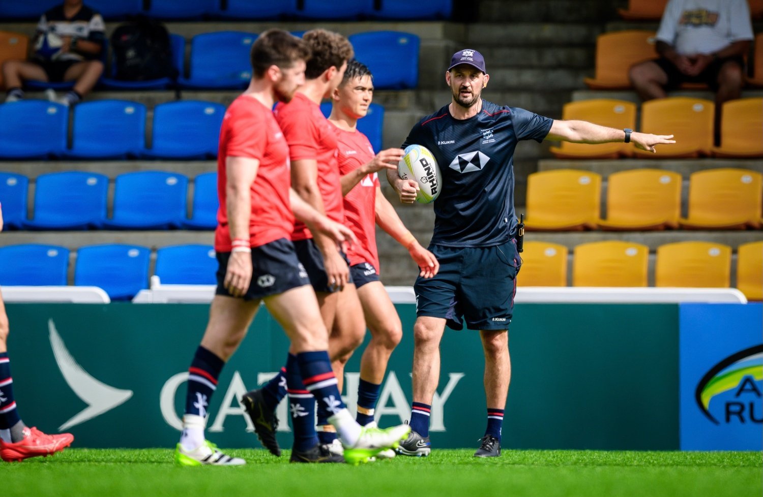 Incoming head coach Logan Asplin (right) putting the Hong Kong team through a warm-up session ahead of an Asia Rugby Championship match. Photo: HKCR