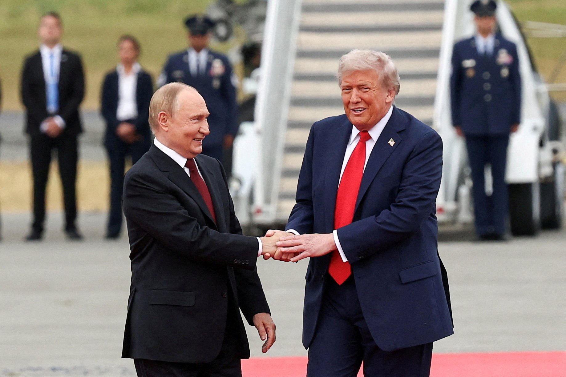 Donald Trump shakes hand with Russian President Vladimir Putin at Joint Base Elmendorf-Richardson in Anchorage, Alaska. Photo: Reuters