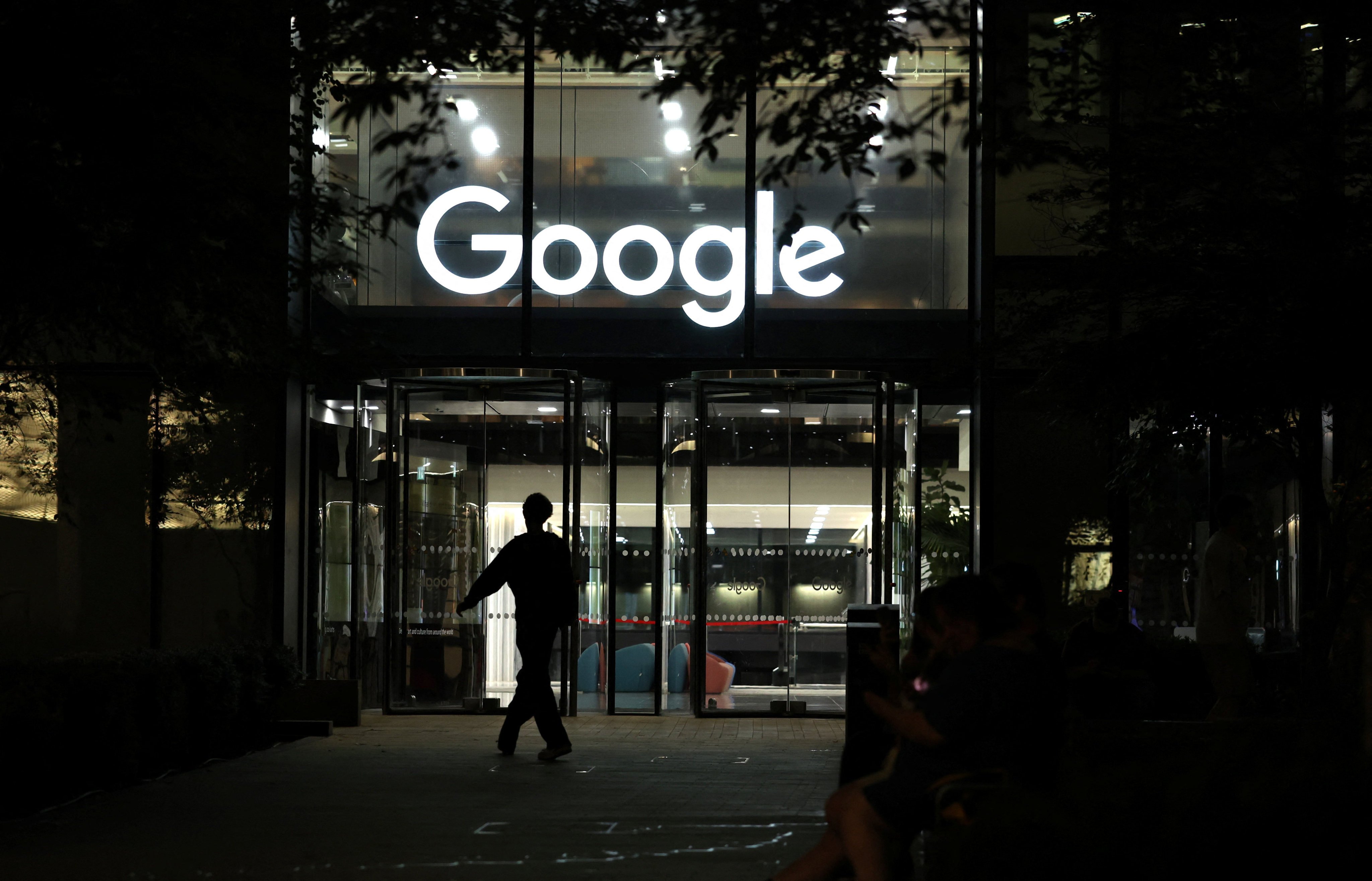 A pedestrian walks past the Google office in London on Thursday. Photo: Reuters