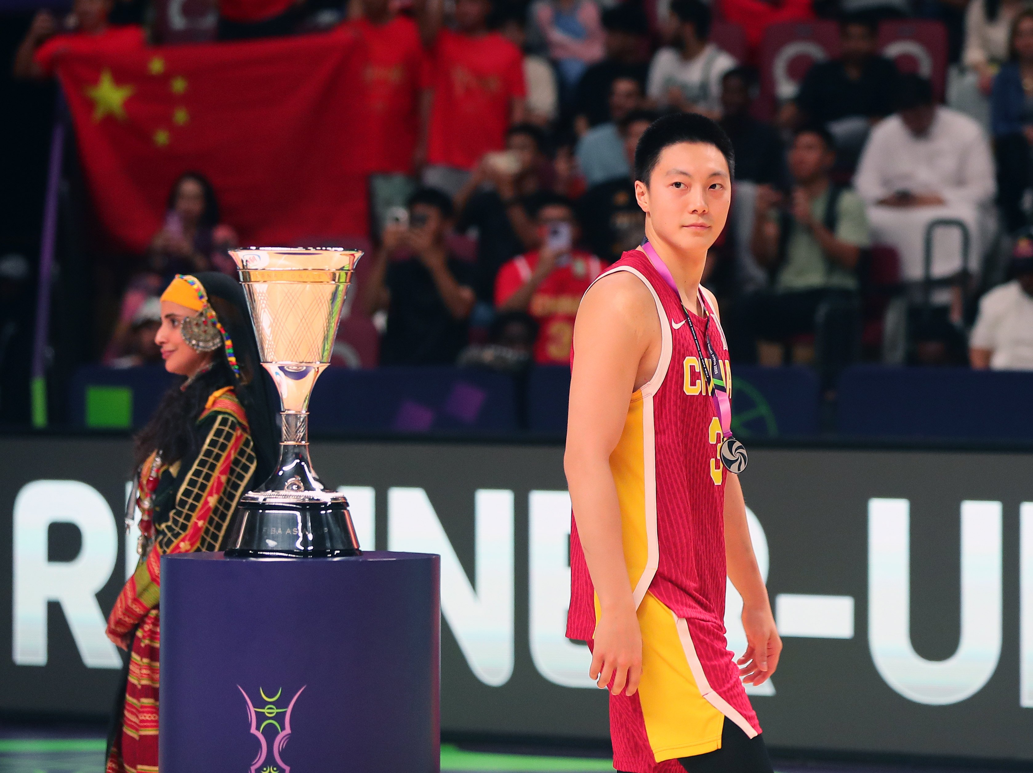 Hu Mingxuan of China glances at the Asia Cup trophy after his side’s loss in the final to Australia. Photo: Xinhua