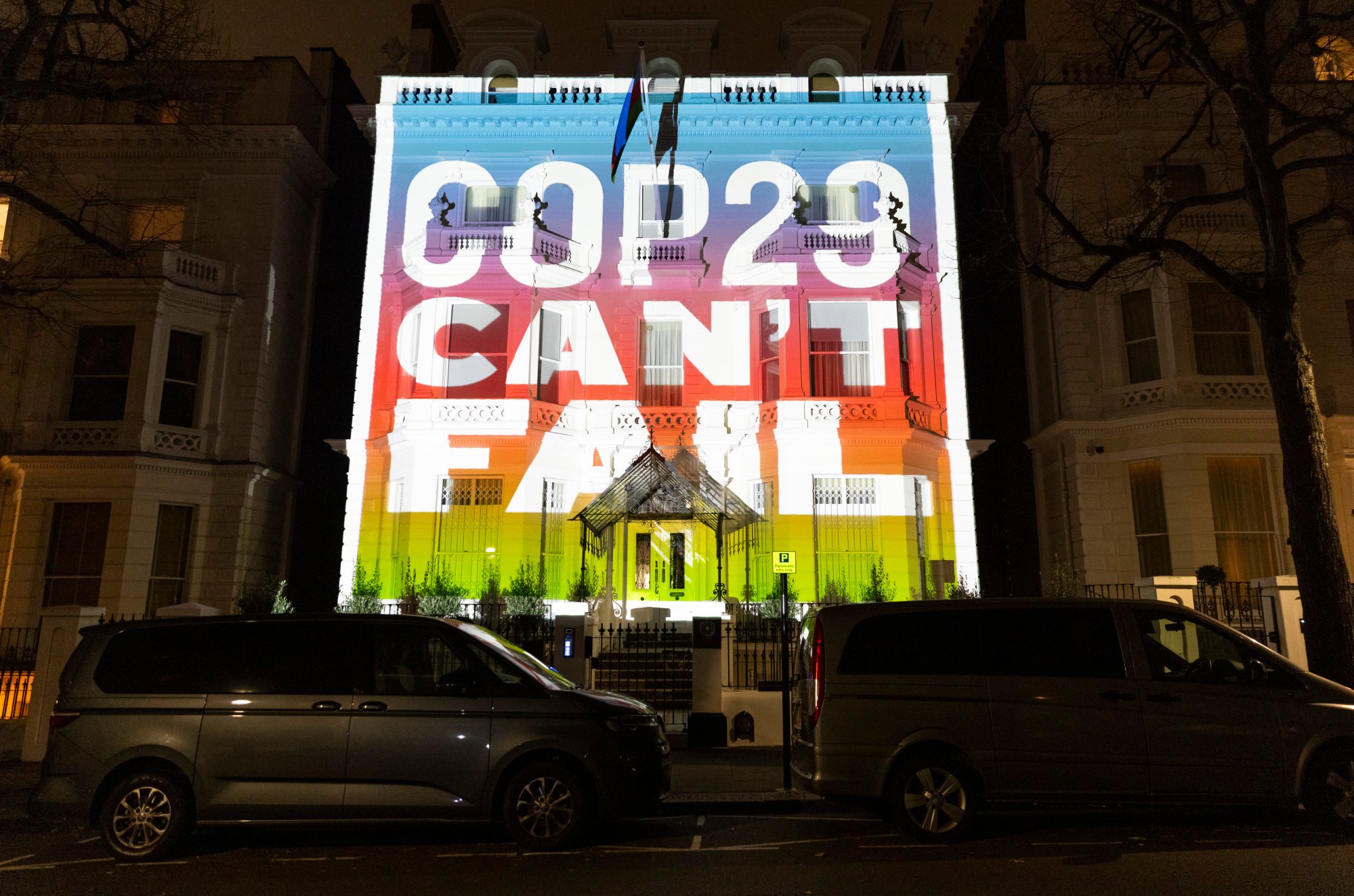 Climate activists projected an image of the COP 29 climate conference on the wall of the Azerbaijan Embassy in London on November 7, 2024. Photo: AP
