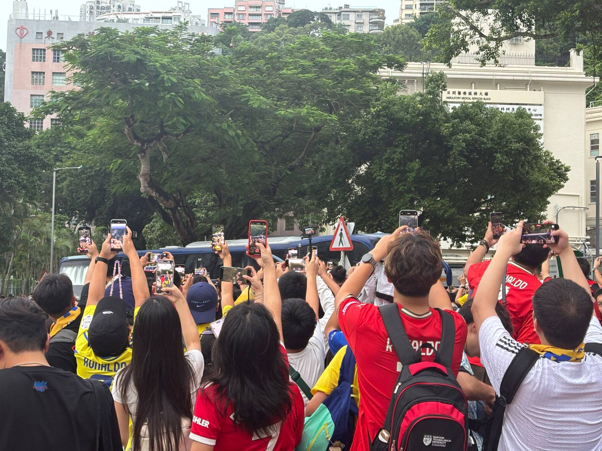 Fans try to get a glimpse of Cristiano Ronaldo ahead of Al-Nassr's Saudi Super Cup clash with Al-Ittihad at Hong Kong Stadium. Photo: Lars Hamer