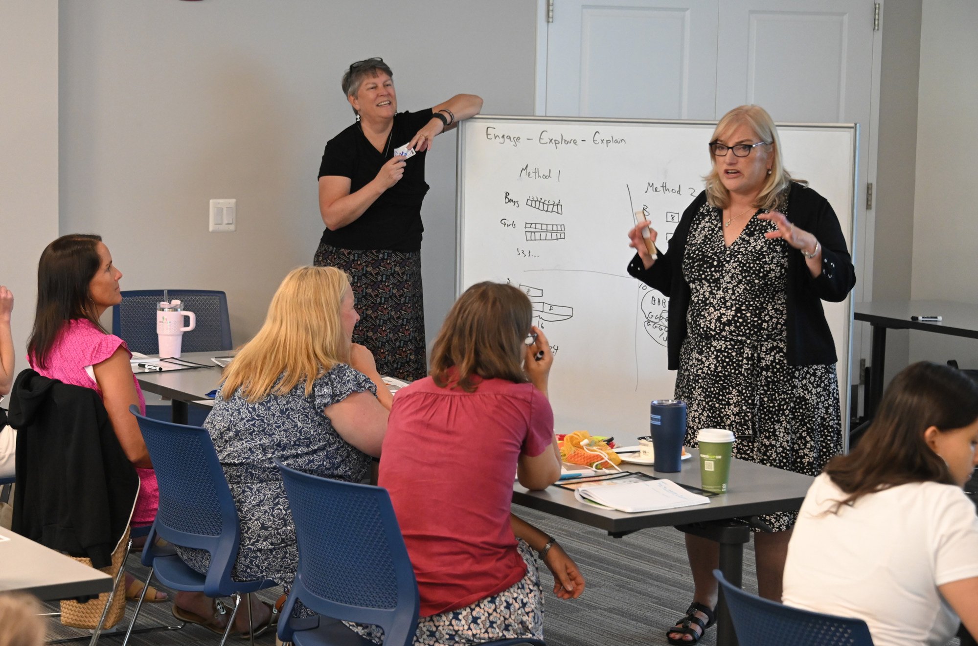 Cassy Turner (left) and Susan Resnick work with teachers at a two-day workshop on the Singaporean method of maths instruction at a school in Maryland. Photo: TNS