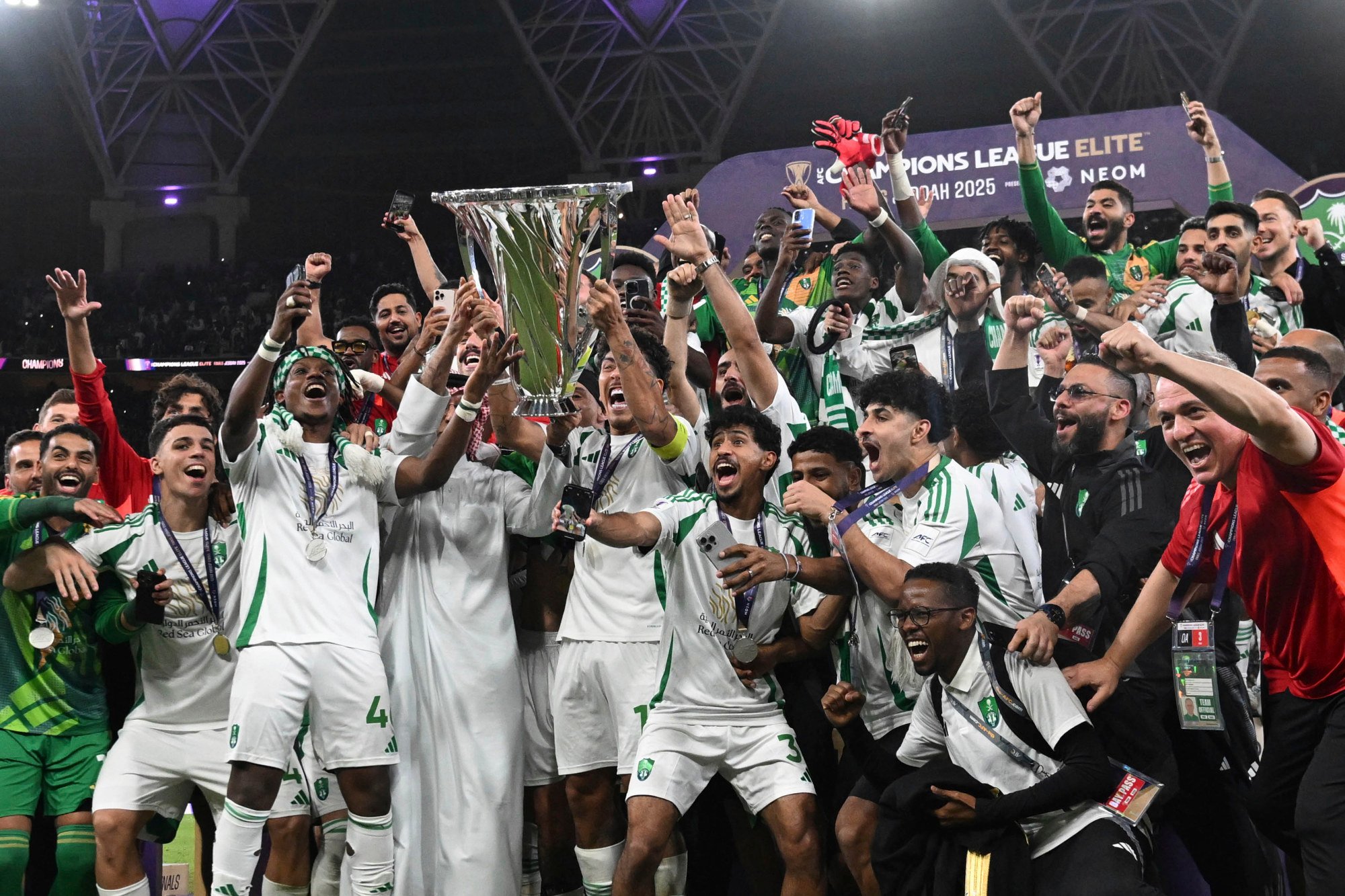 Al-Ahli's players celebrate their AFC Champions League Elite triumph in May. Photo: AP