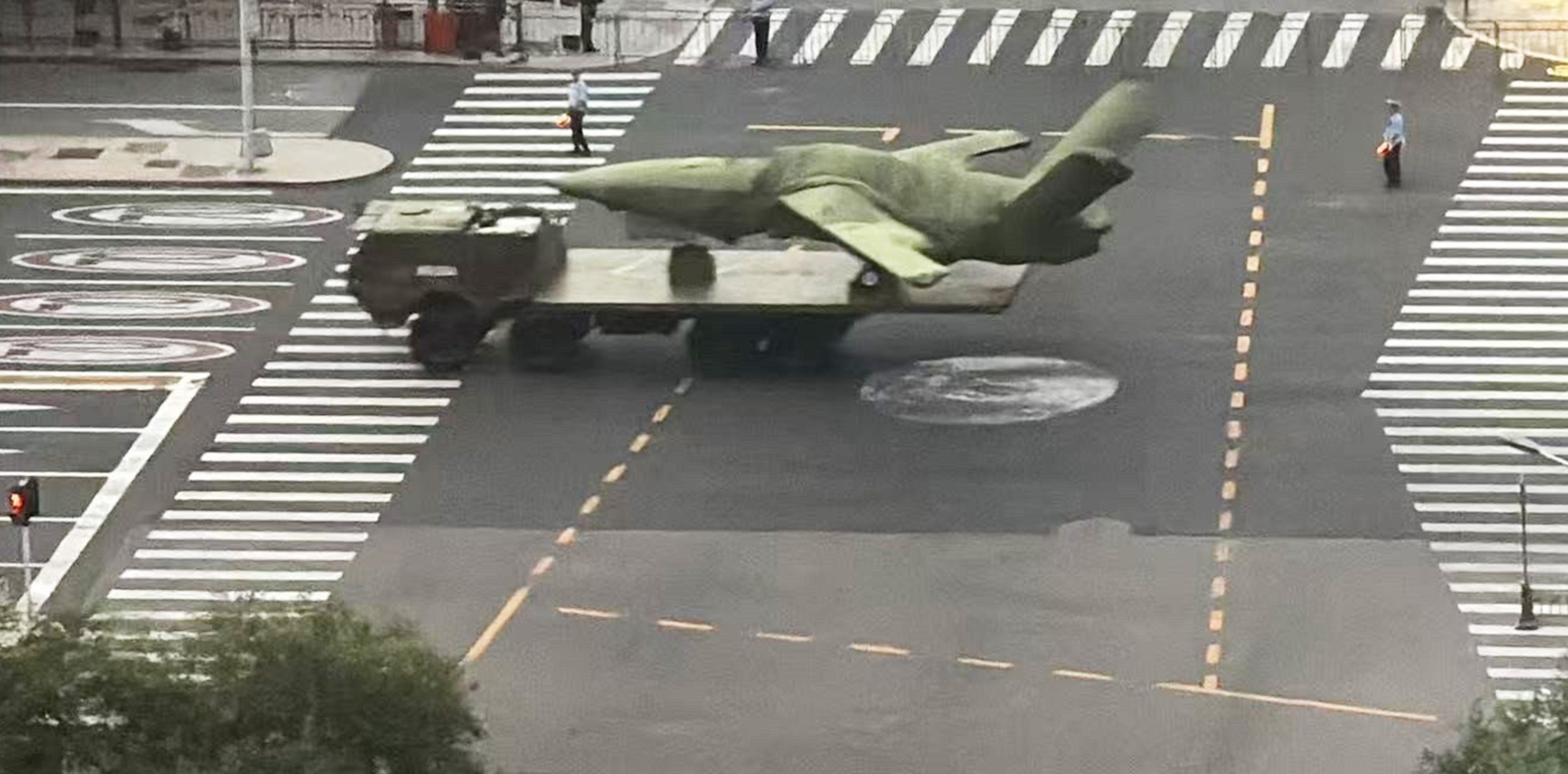 A photo leaked online purports to show a truck-mounted FH-97stealth drone rolling down a street in central Beijing. Photo: Handout