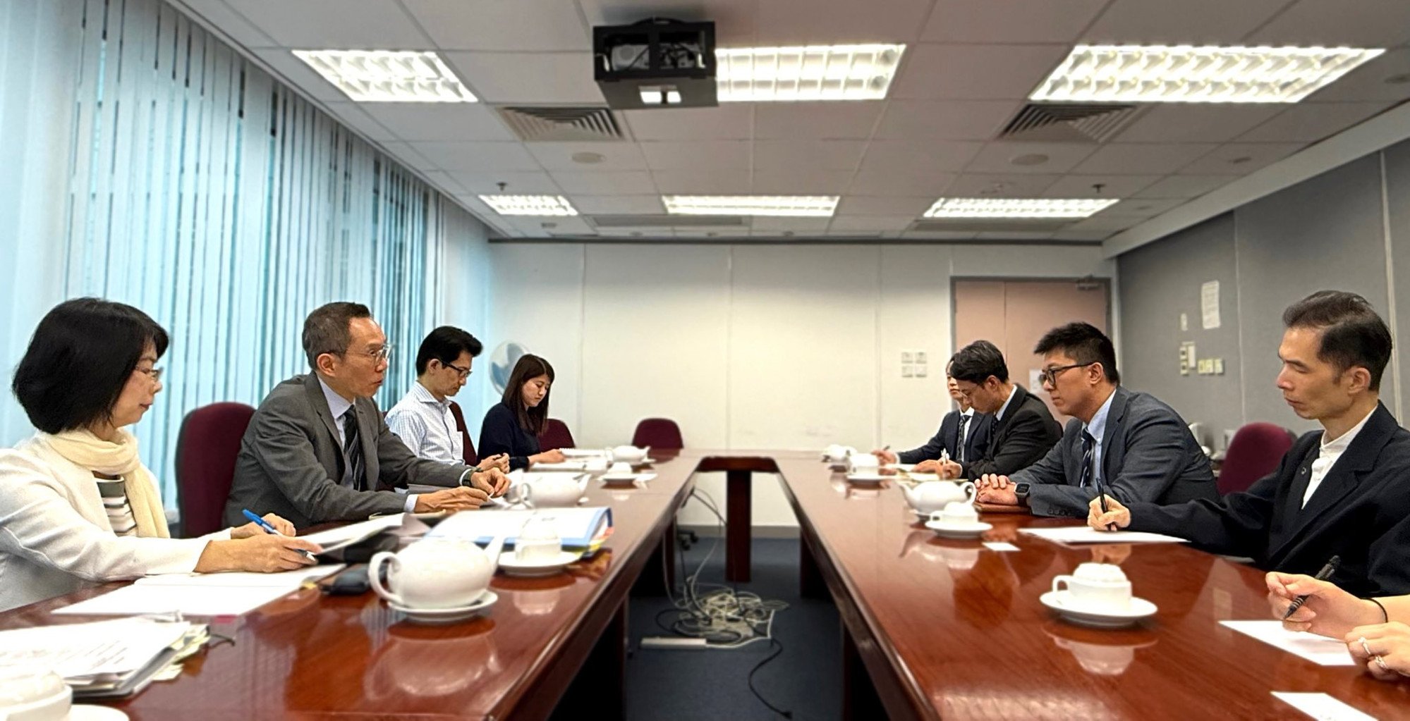 Audit Commission staff meet officials from government departments to discuss the water contract. Photo: Handout
