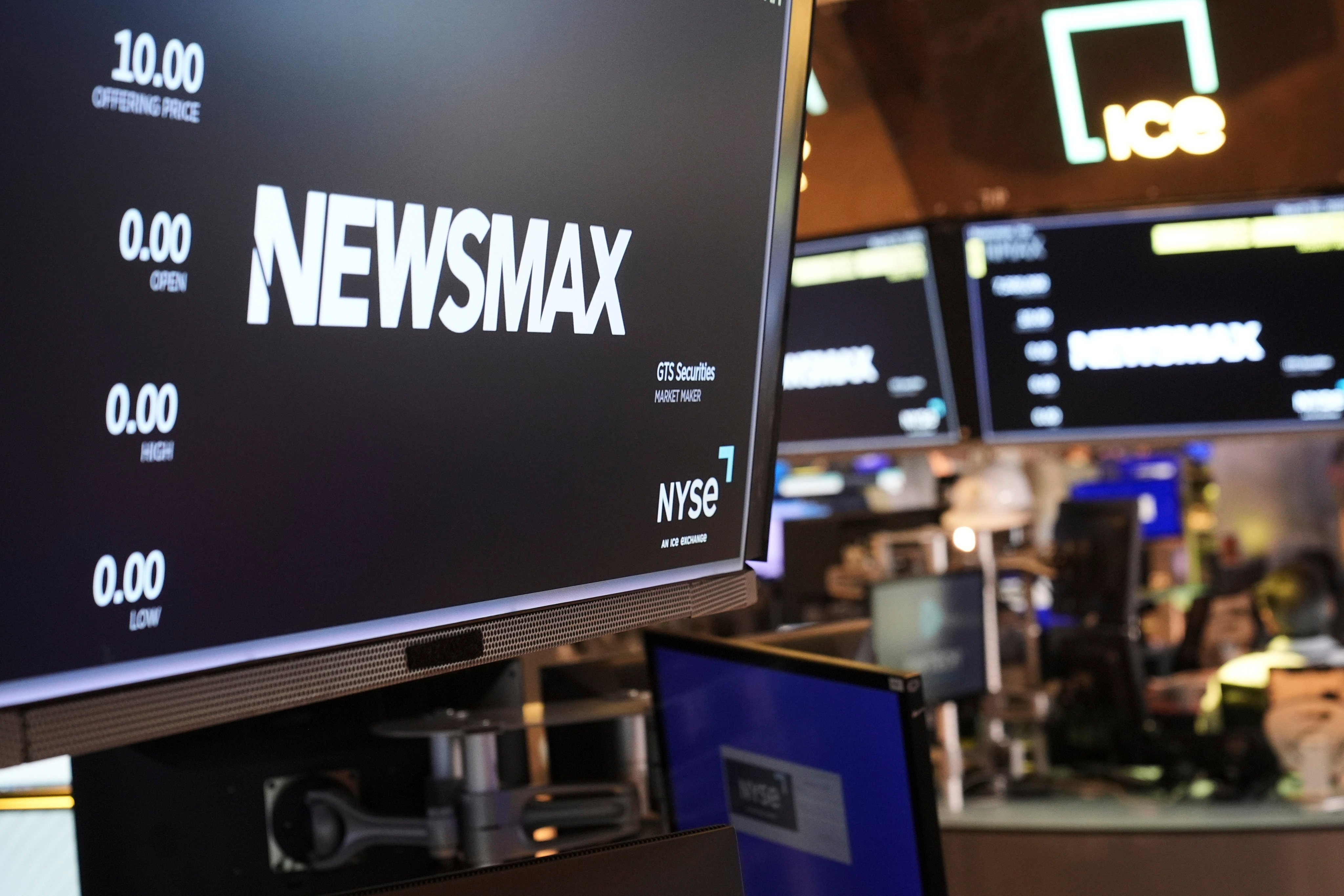 A Newsmax logo on the floor at the New York Stock Exchange in New York. Photo: AP