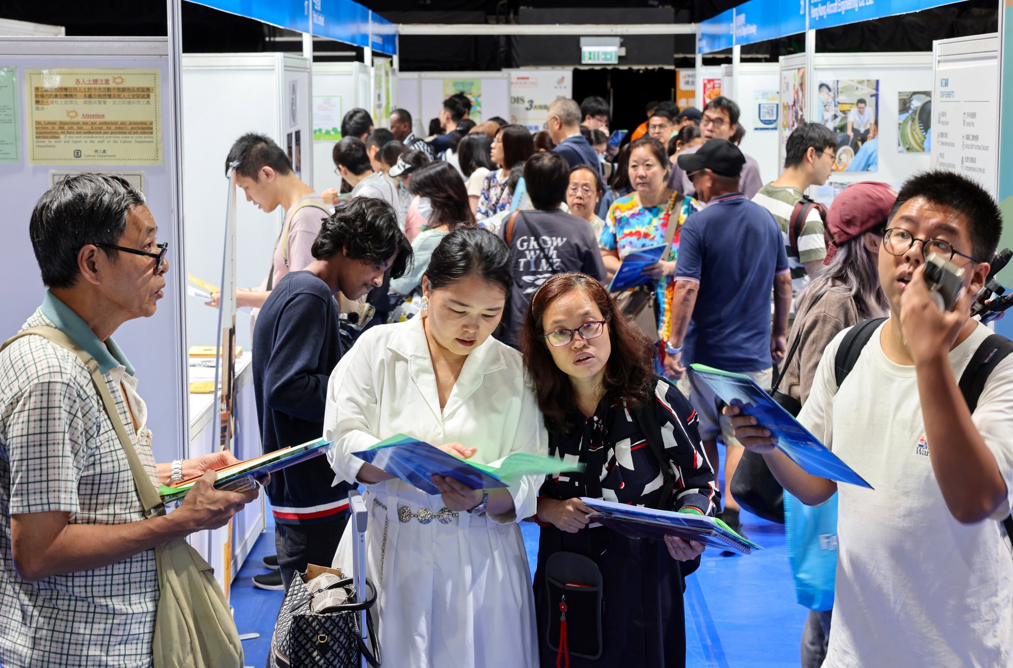 Jobseekers check out a recent Labour Department fair in Mong Kok. Photo: Nora Tam