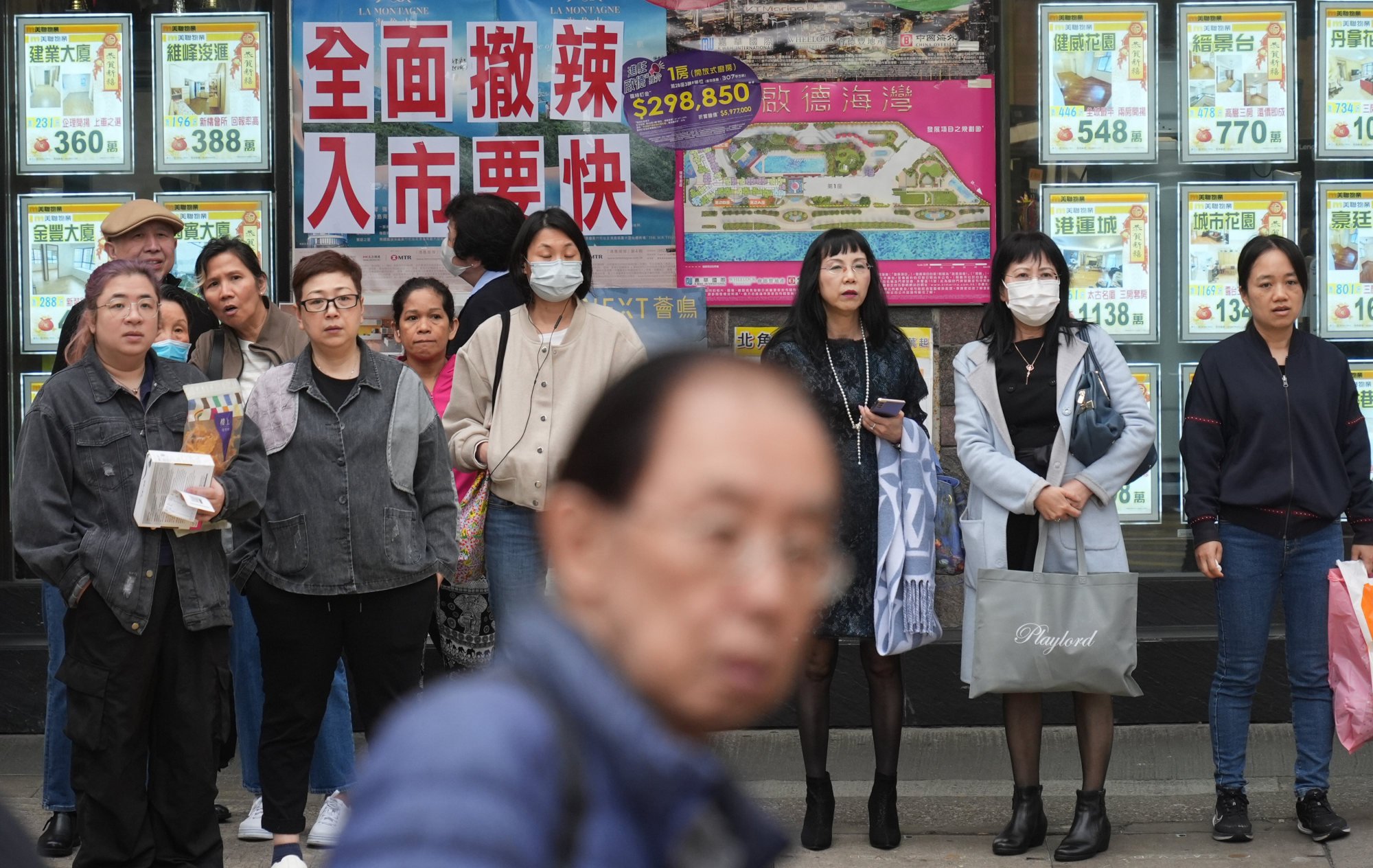 Homes for leasing and sale are displayed at property agency in North Point. Photo: Eugene Lee