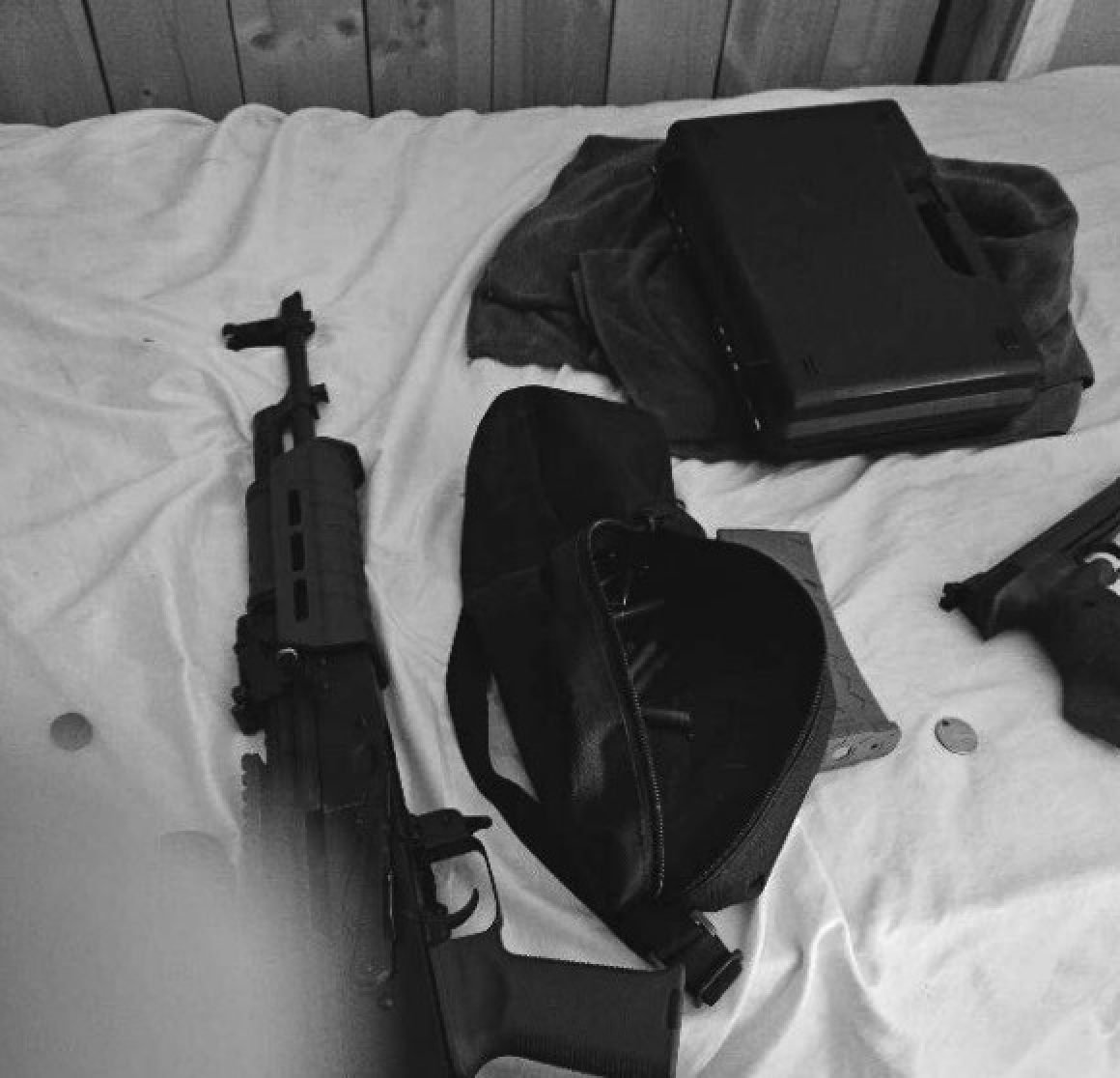 Photo of a gun and military electronics found on Shenghua Wen's phone. Photo: US Department of Justice