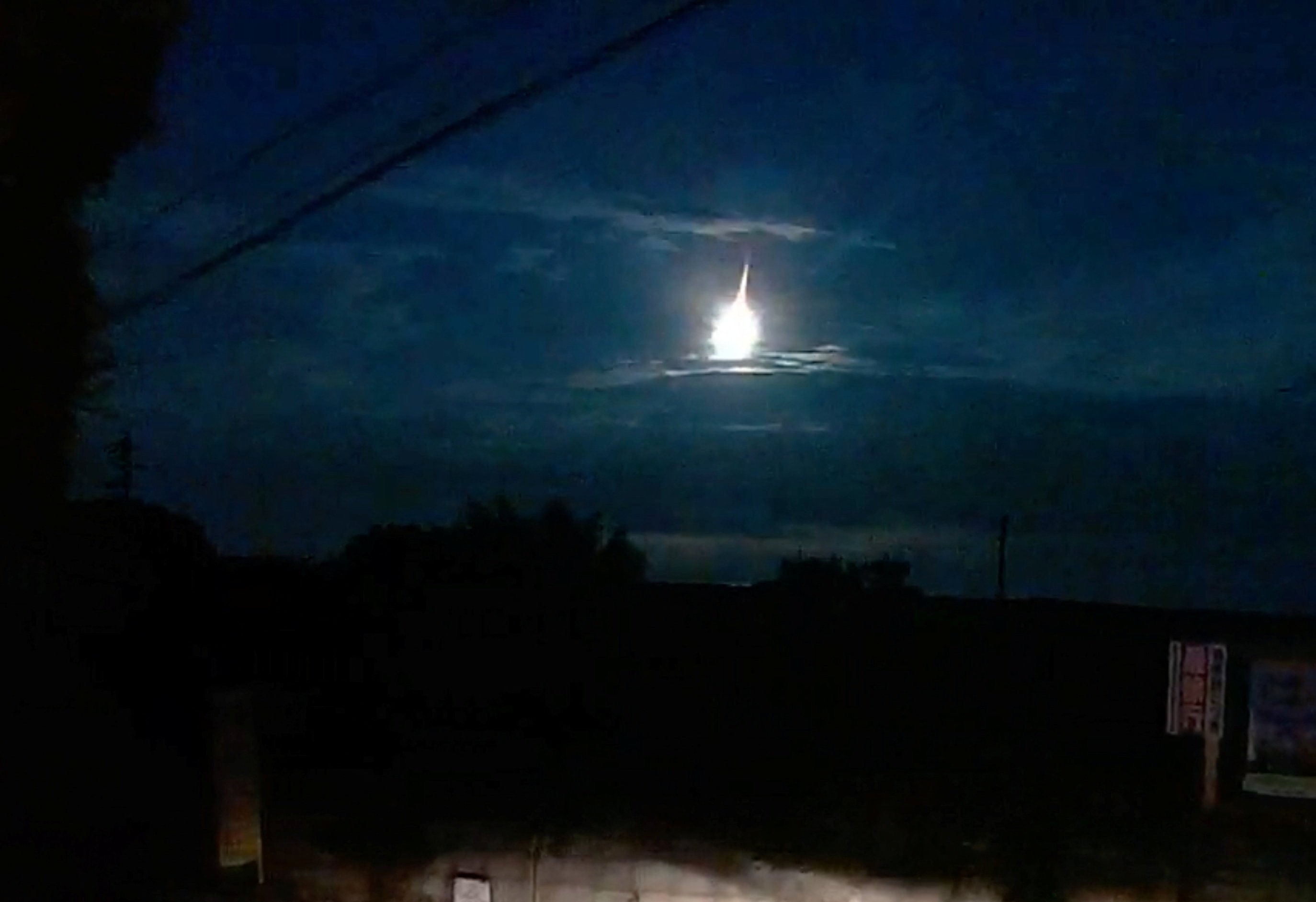 A fireball streaks across the sky, as seen from Kumamoto, Kyushu, Japan, August 19, 2025.