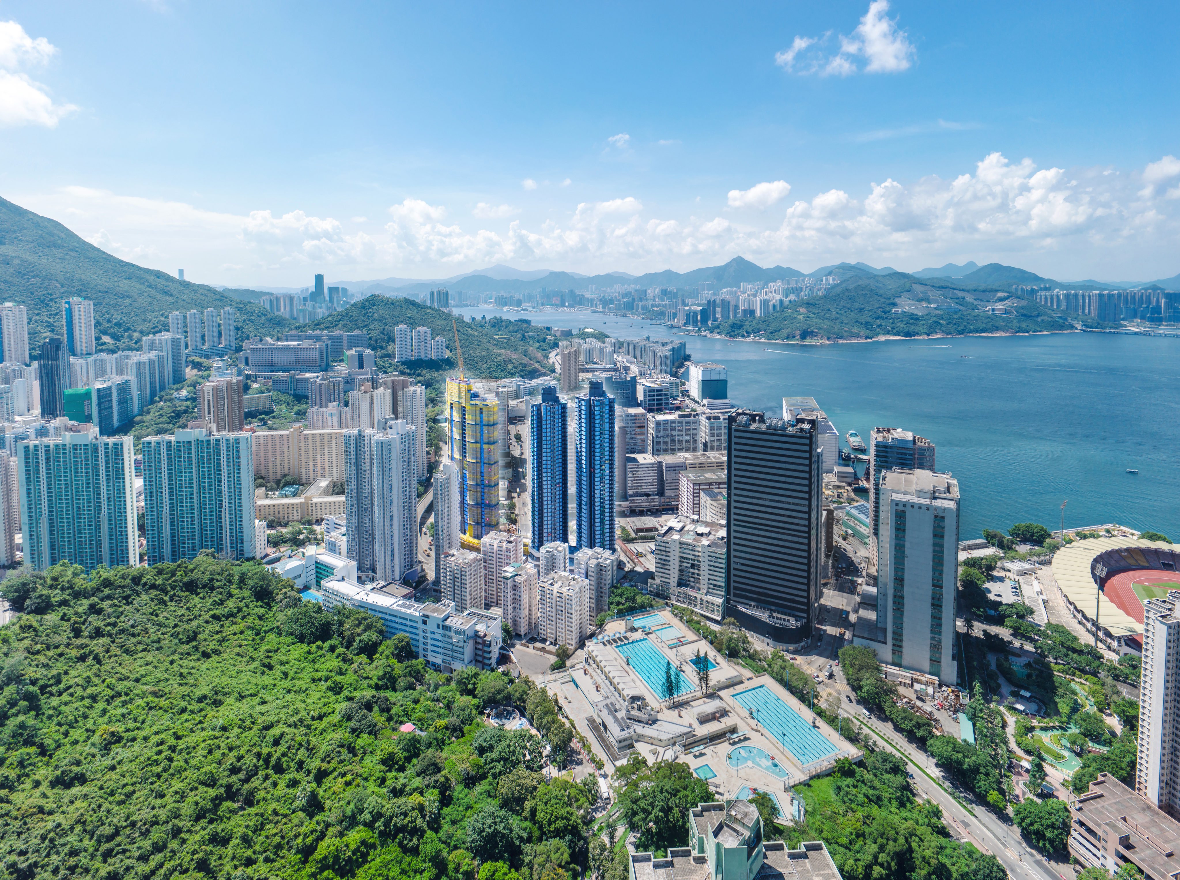 The Headland Residences comprises the two blue towers (centre) and the tower under construction to their left in this undated photo. Photo: Handout