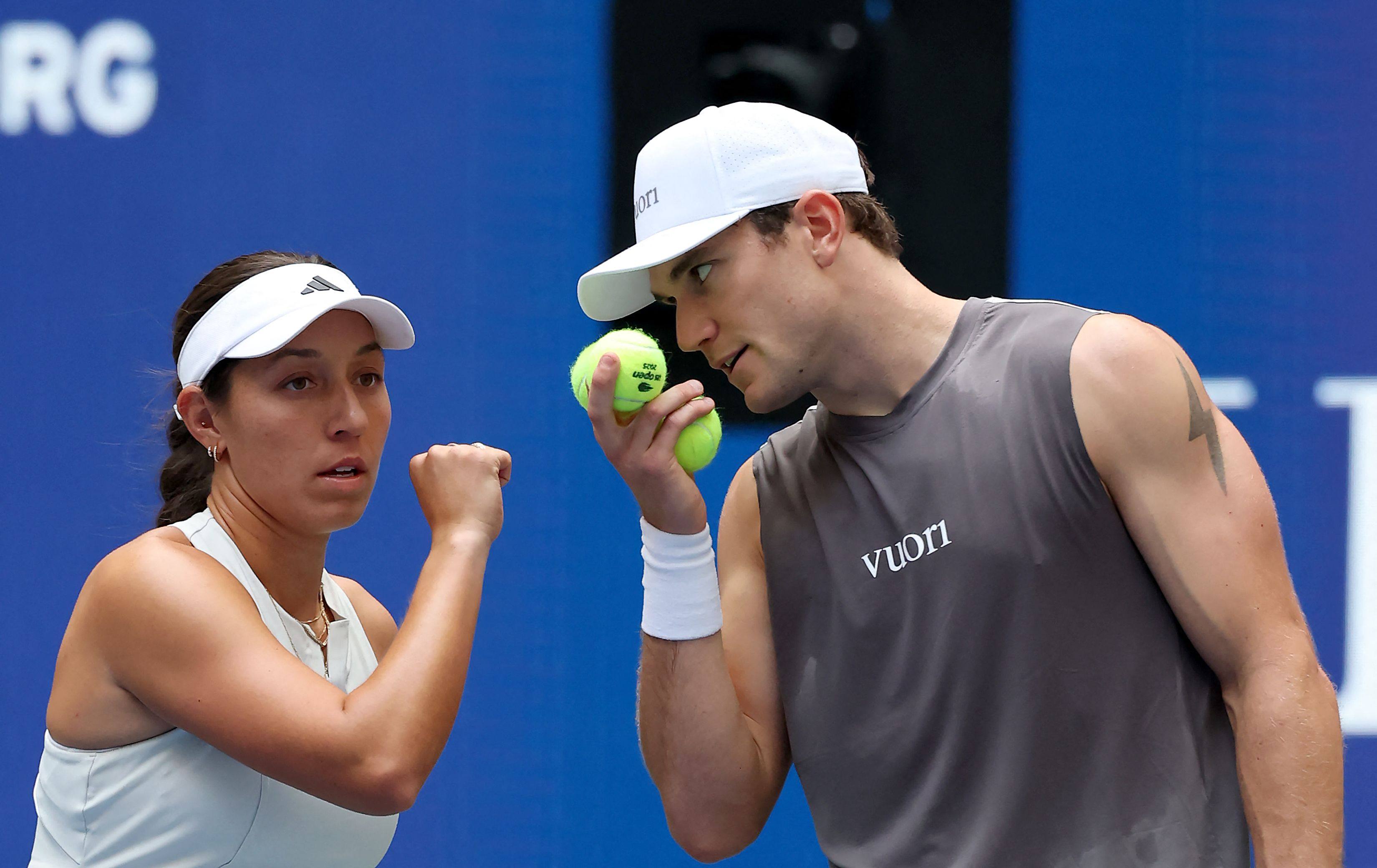 Mixed doubles pair Jessica Pegula (left) and Jack Draper in discussion during their match against Daniil Medvedev and Mirra Andreeva. Photo: AFP