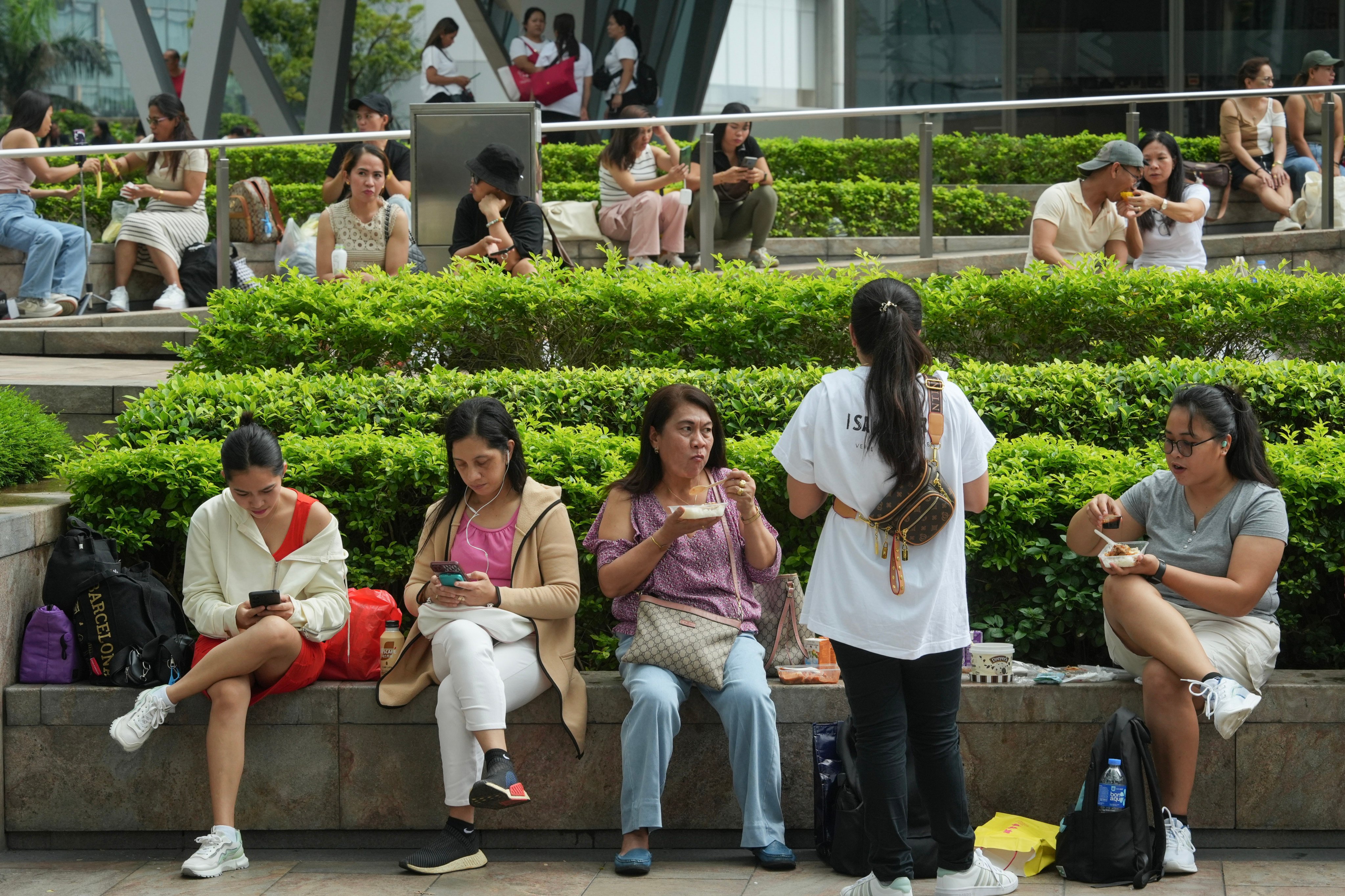 Foreign domestic helpers spend time in Central during a day off. Photo: Sun Yeung