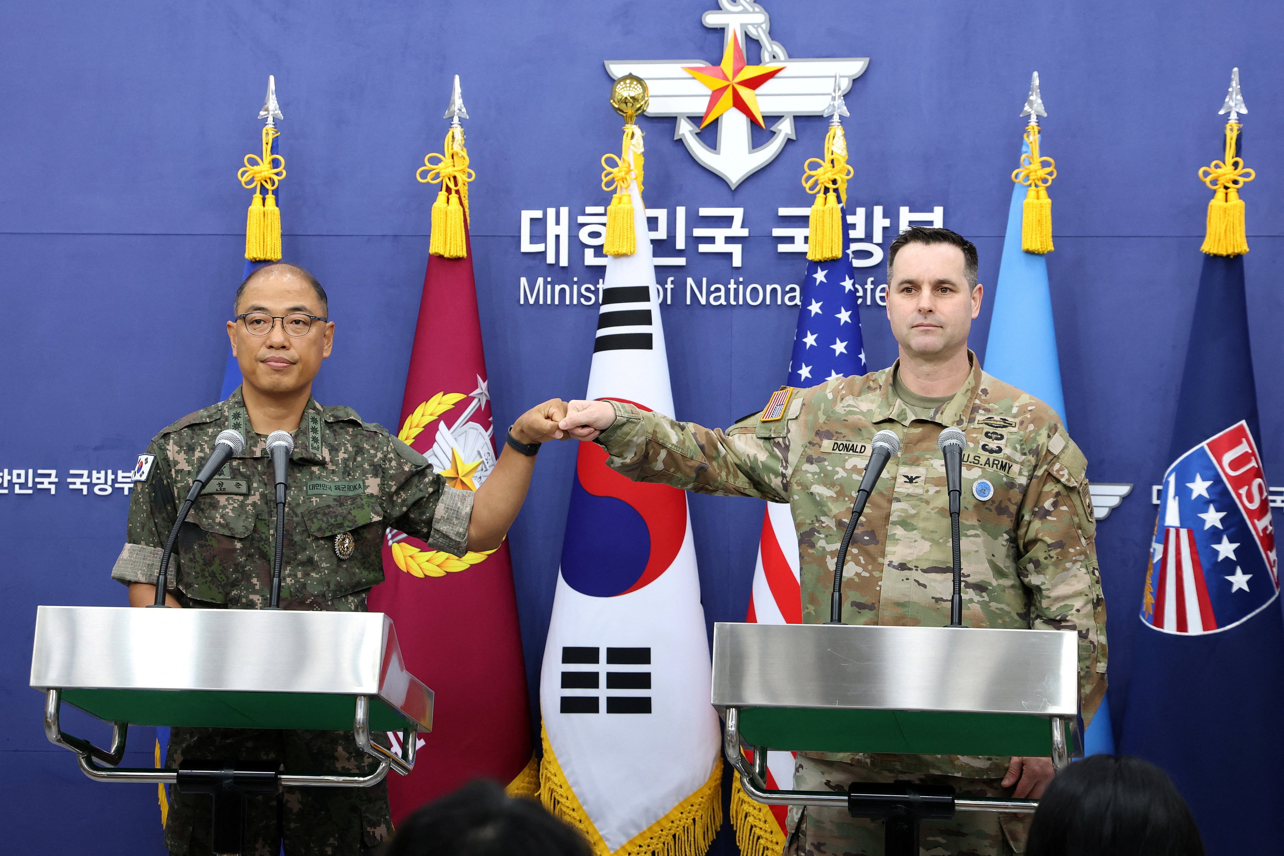 Colonel Lee Sung-jun (left) public affairs director of South Korea’s Joint Chiefs of Staff, and Colonel Ryan Donald, public affairs director of the United States Forces Korea, attend a press briefing on the Ulchi Freedom Shield exercises at the Defence Ministry in Seoul on August 7. Photo: Reuters
