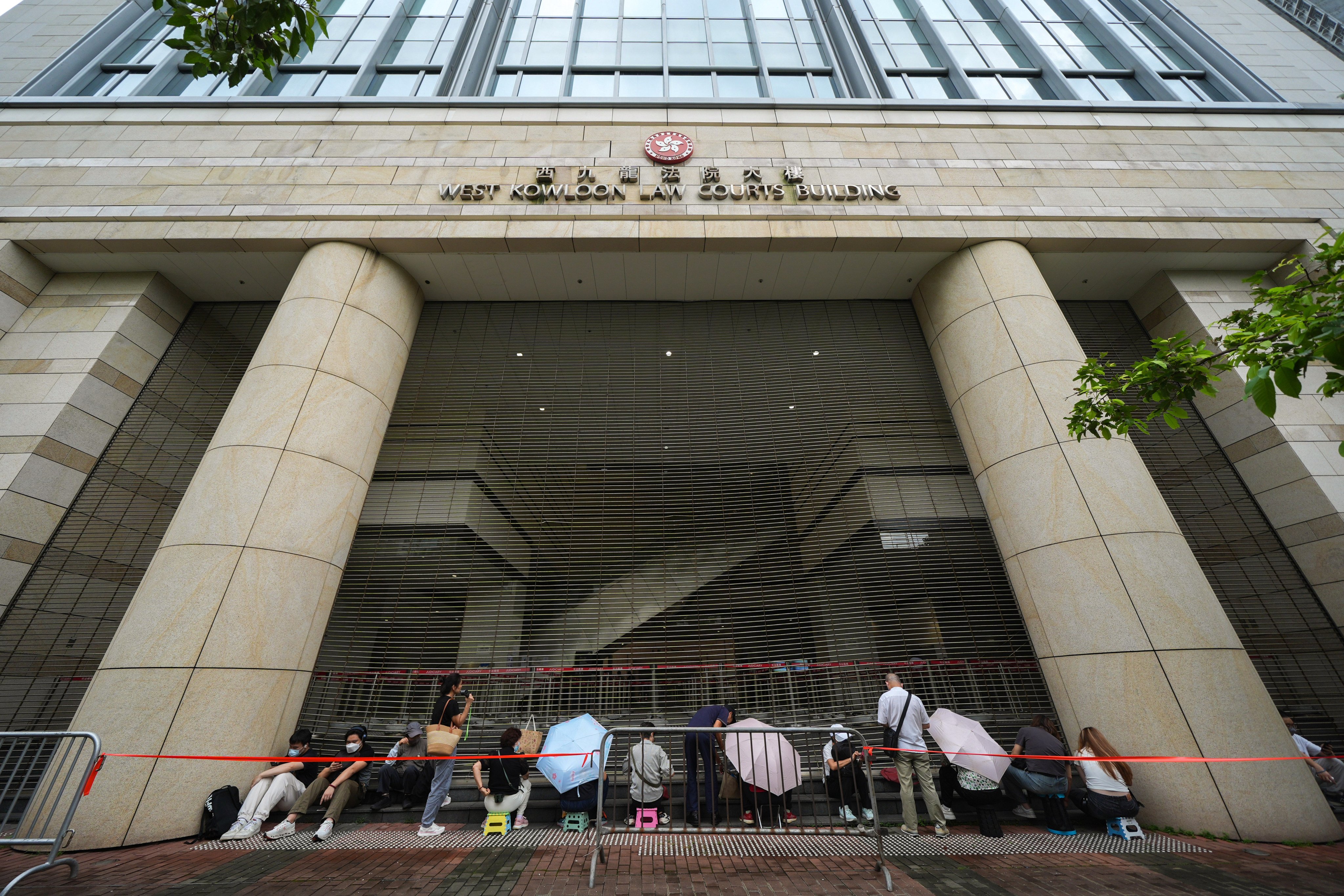 People queue up to enter West Kowloon Court for spots in the public gallery for Jimmy Lai’s trial. Photo: Eugene Lee