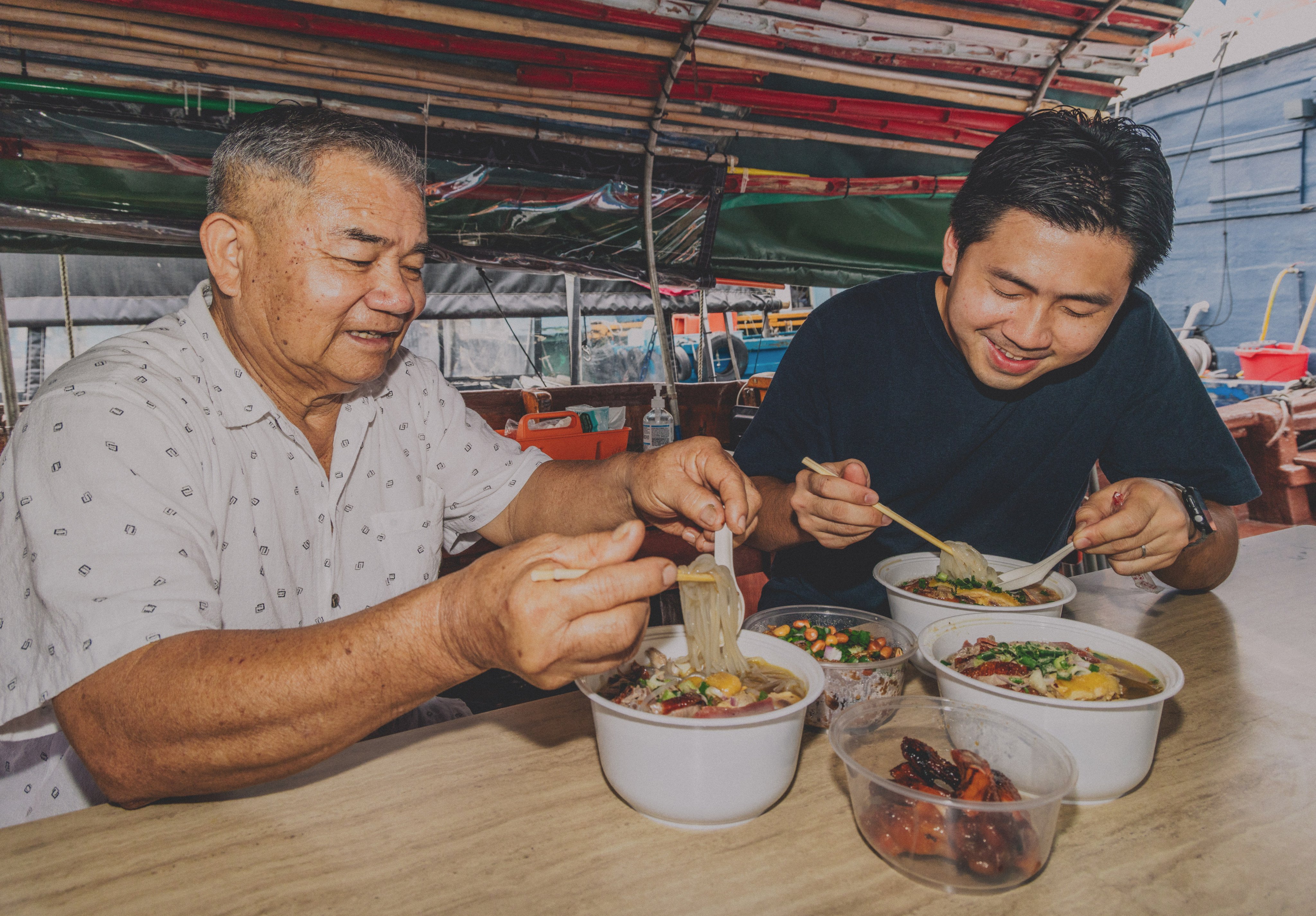 Lam Lau with his son Aidan at Lau Kee Boat Noodles in Hong Kong, which has been in business since 1981. Photo: Jocelyn Tam