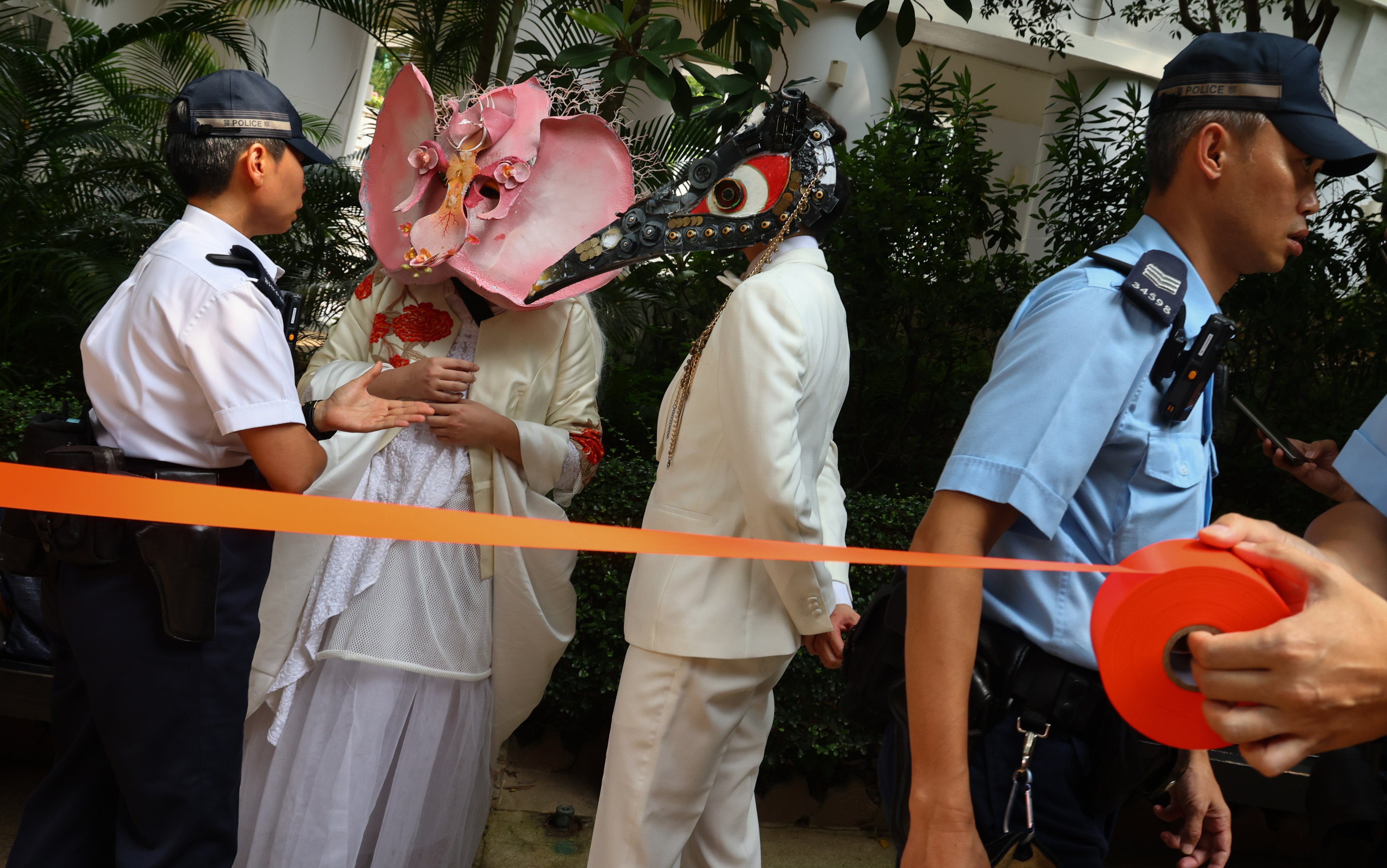 Supporters of the same-sex partnership registration bill, wearing masks of monsters to protest against the demonisation and exclusion of same-sex couples, demonstrate outside the Cotton Tree Drive Marriage Registry, in Admiralty, Hong Kong, on July 28. Photo: Dickson Lee