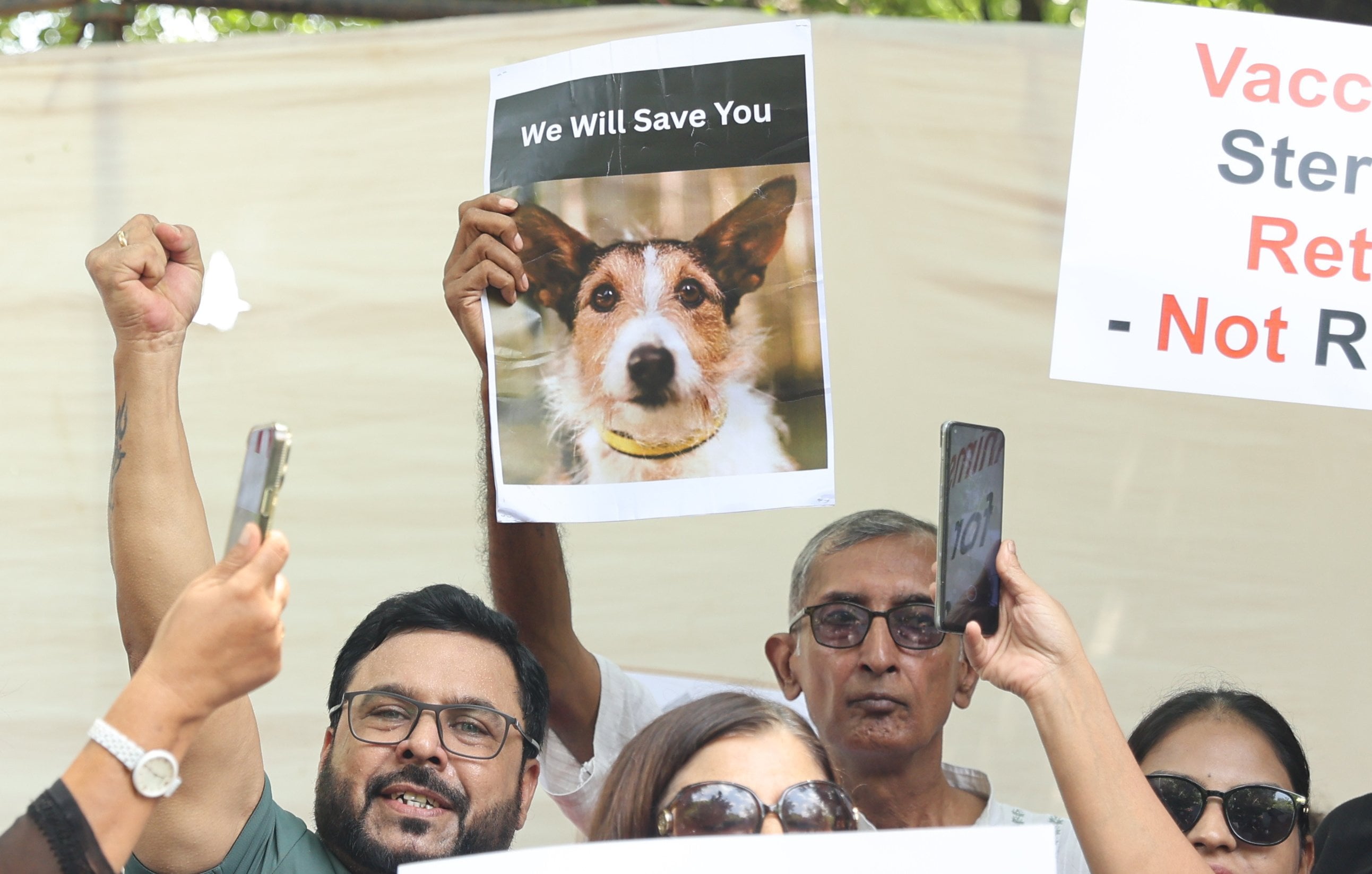 People protest in solidarity with stray dogs in New Delhi, India on Thursday. Photo: EPA