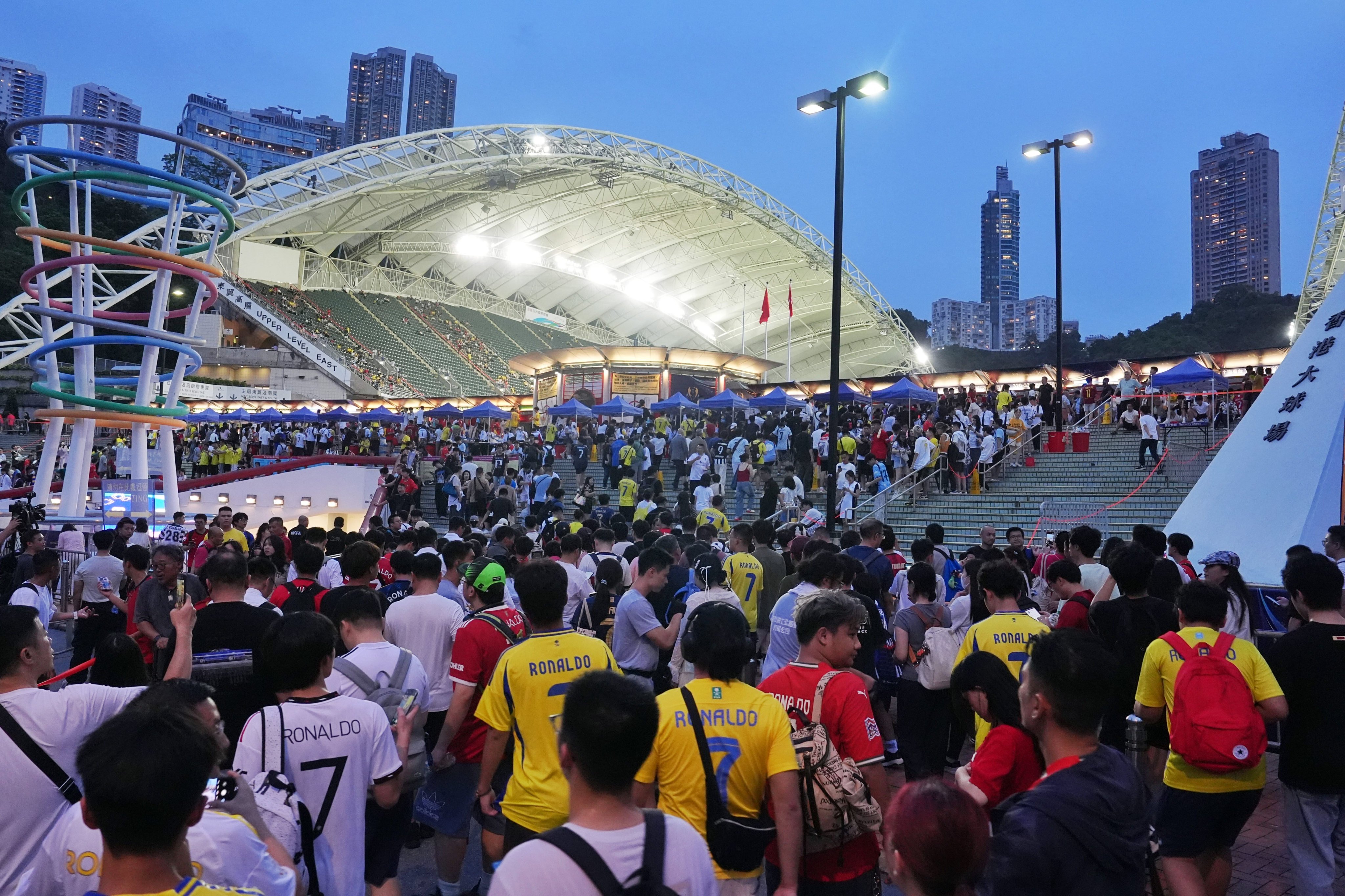Football fans enter Hong Kong Stadium for the first match of Saudi Super Cup between Al-Nassr and Al-Ittihad in Hong Kong on August 19. Photo: Elson Li