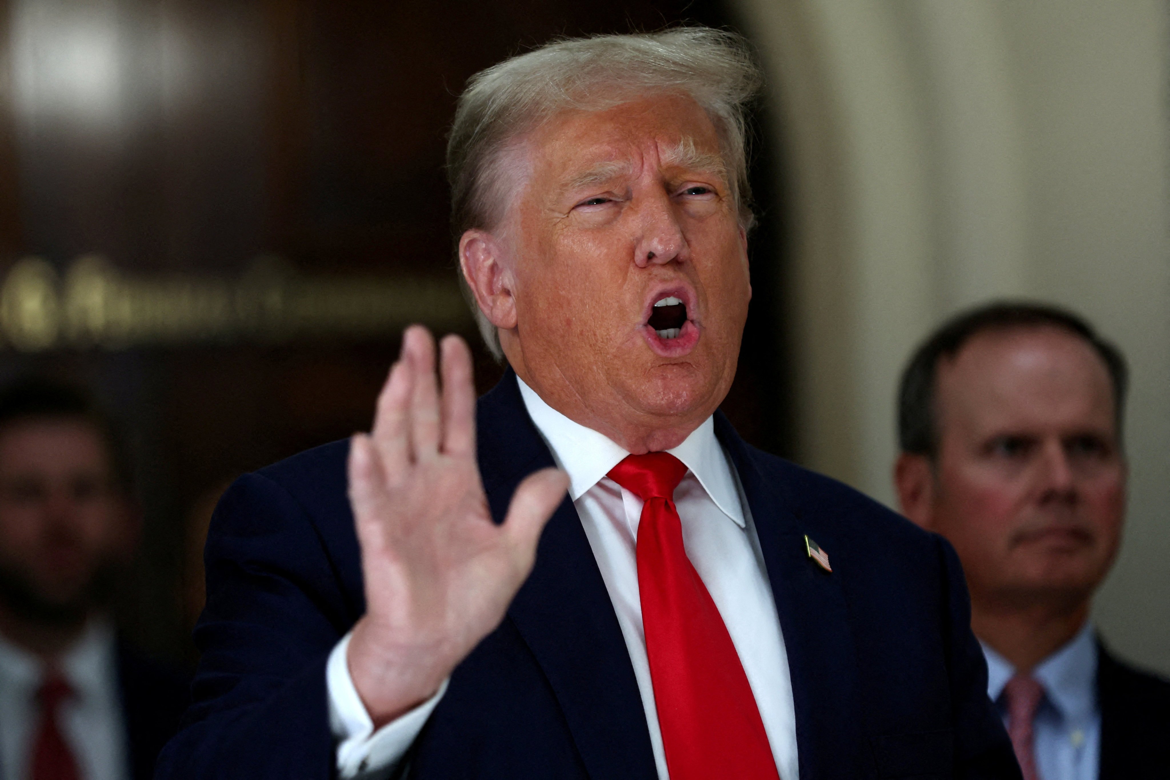 Donald Trump gestures while talking to the media during a break as he attends trial in a civil fraud case brought by state Attorney General Letitia James against him, his adult sons, the Trump Organisation and others in New York in October 2023. Photo: Reuters