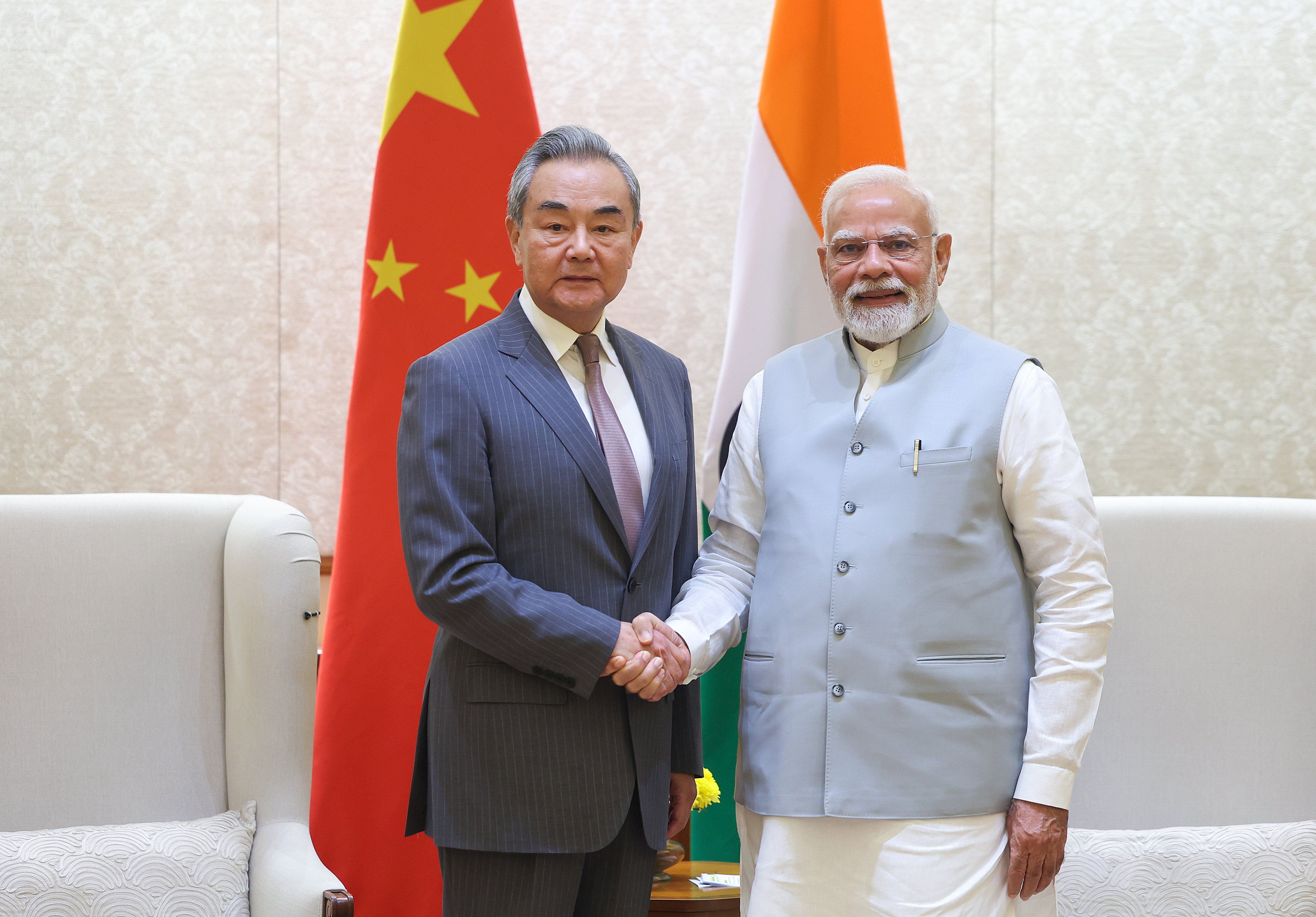 Foreign Minister Wang Yi is greeted by Indian Prime Minister Narendra Modi in New Delhi on August 19. Photo: EPA