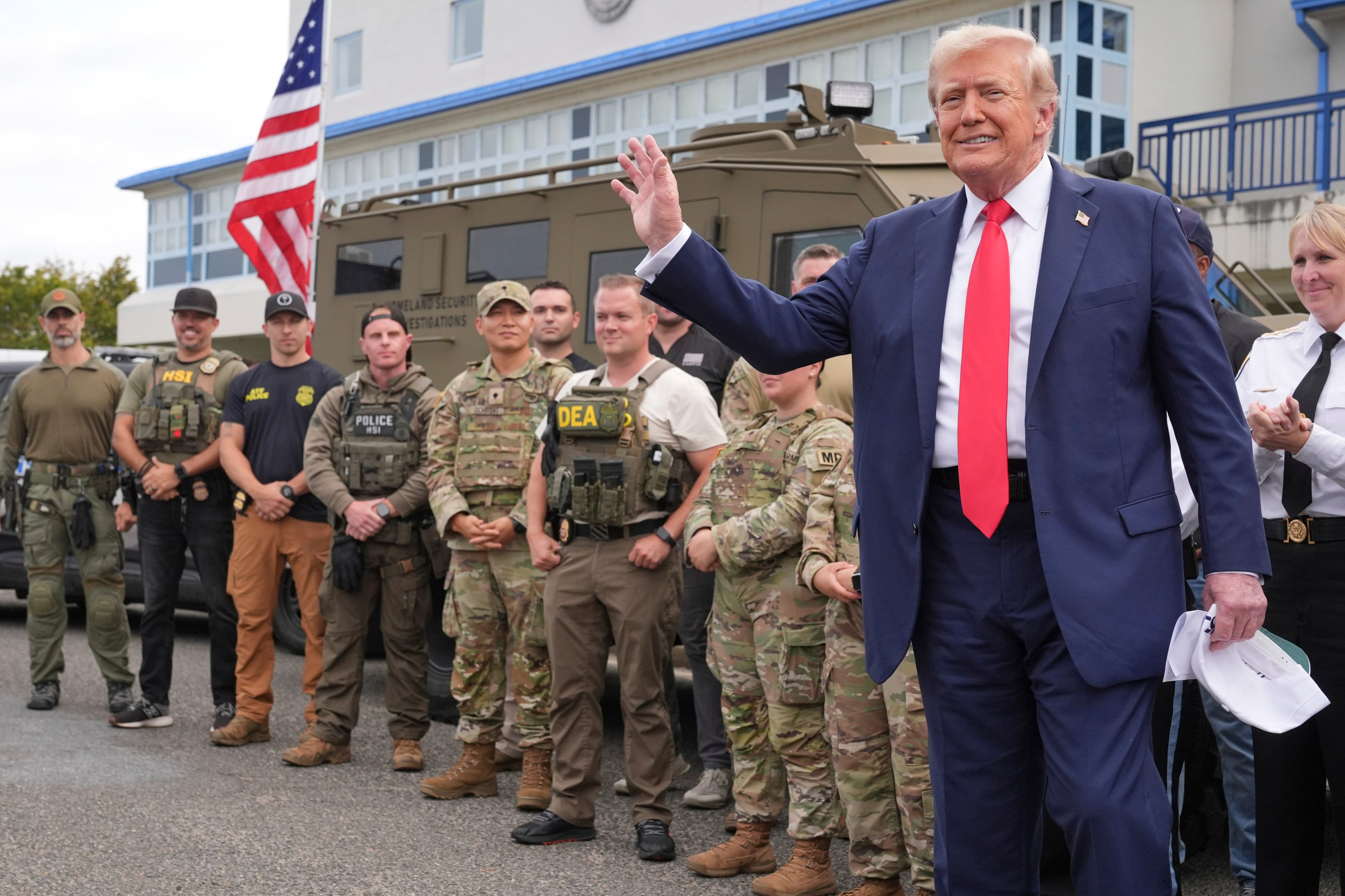 US President Donald Trump visits law enforcement officers and National Guard soldiers in Washington on Thursday. Photo: AP