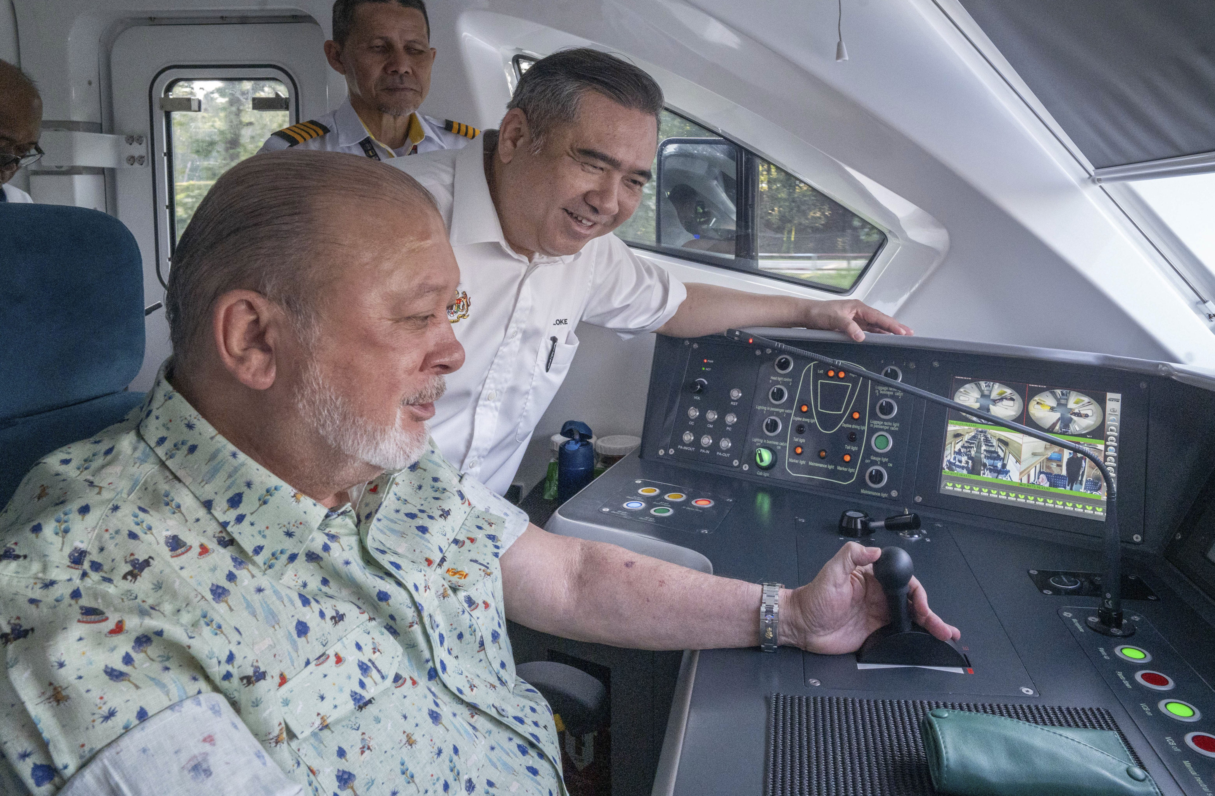 Malaysian king Sultan Ibrahim Iskandar at the controls of the electric train on Saturday. Photo: Malaysian Transport Ministry