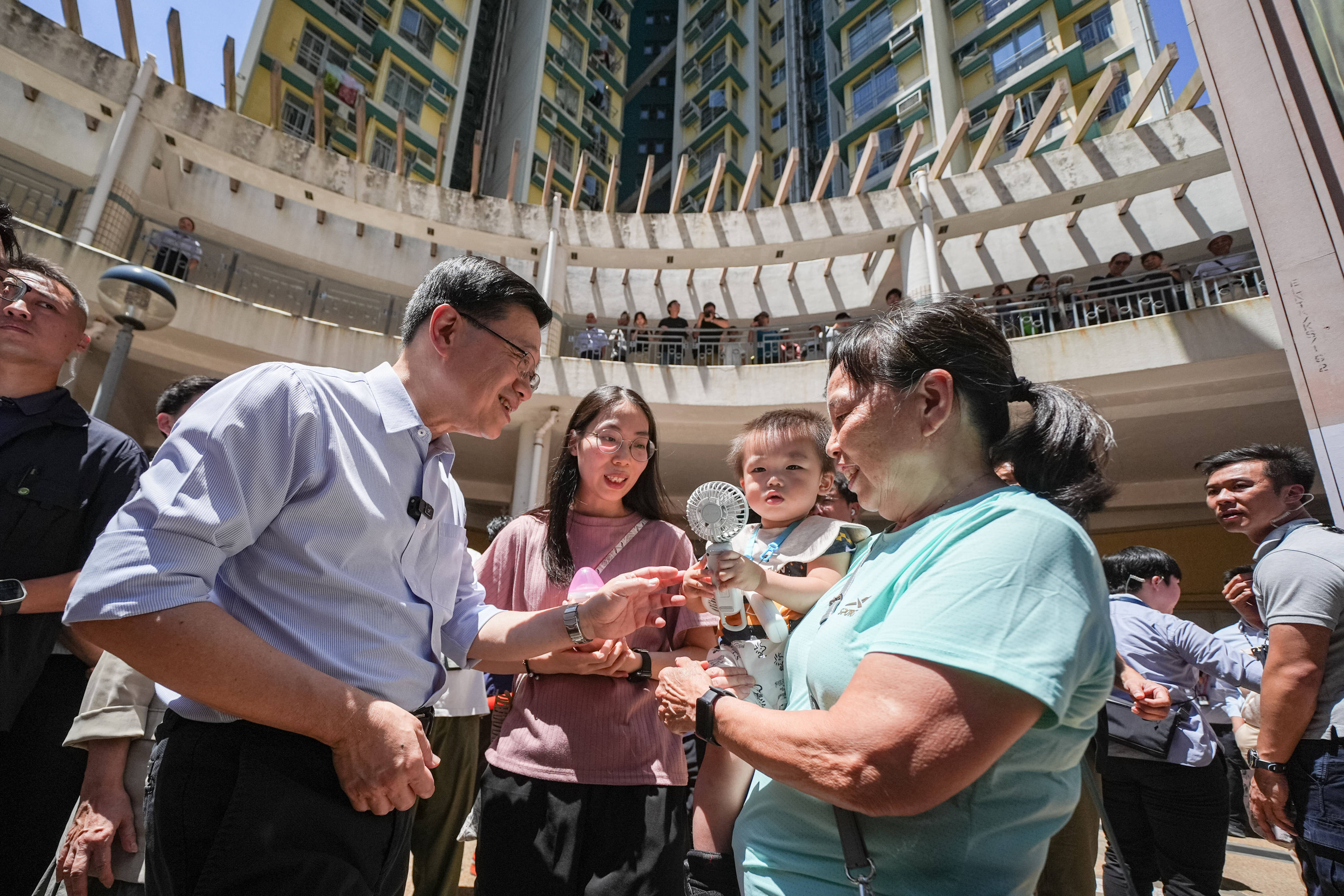 Chief Executive John Lee visits the Lower Ngau Tau Kok Estate. Photo: Eugene Lee