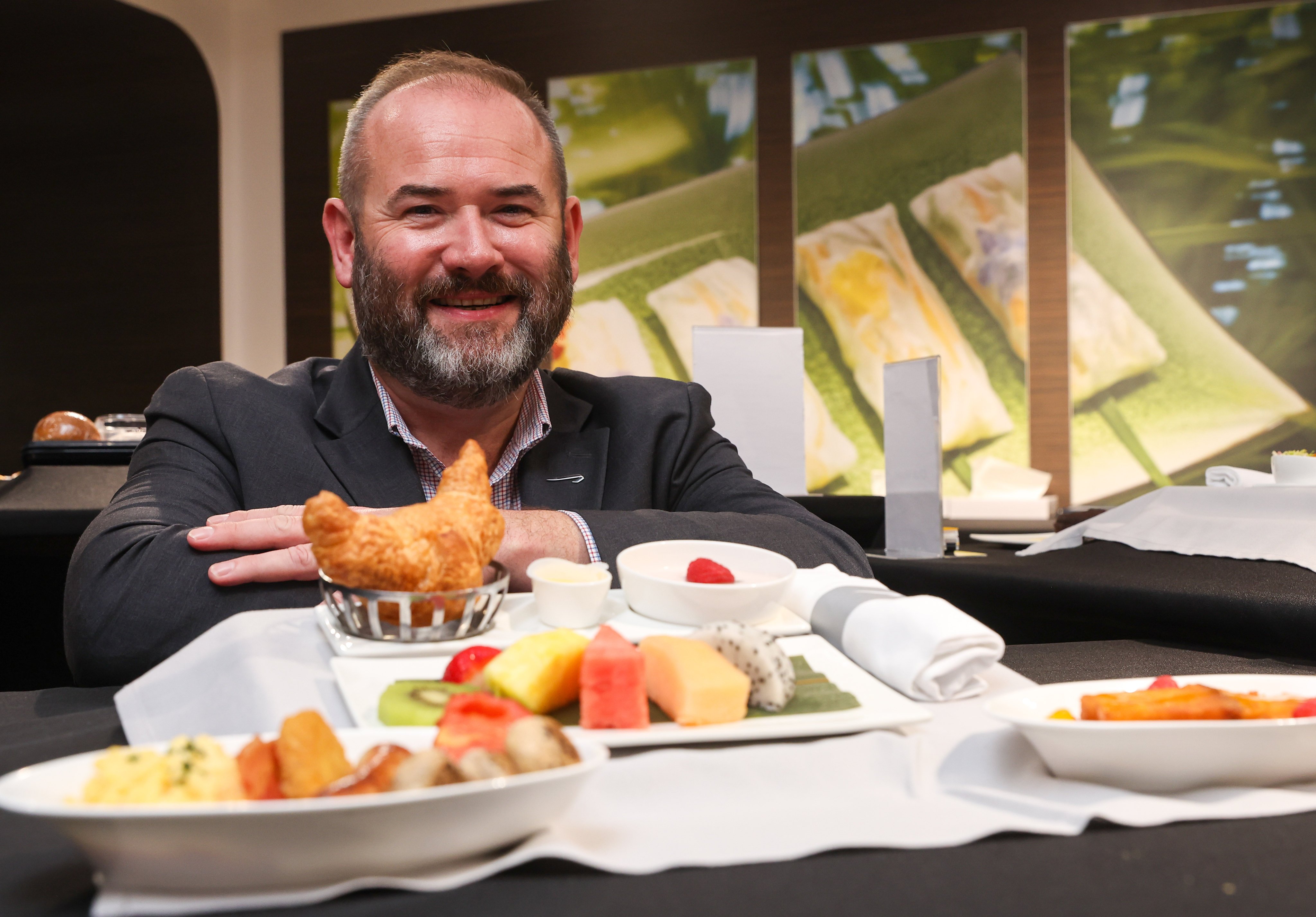 Calum Laming, chief customer officer of British Airways, shows a sample of an in-flight meal at the airline’s catering centre in Chek Lap Kok. Photo: Edmond So