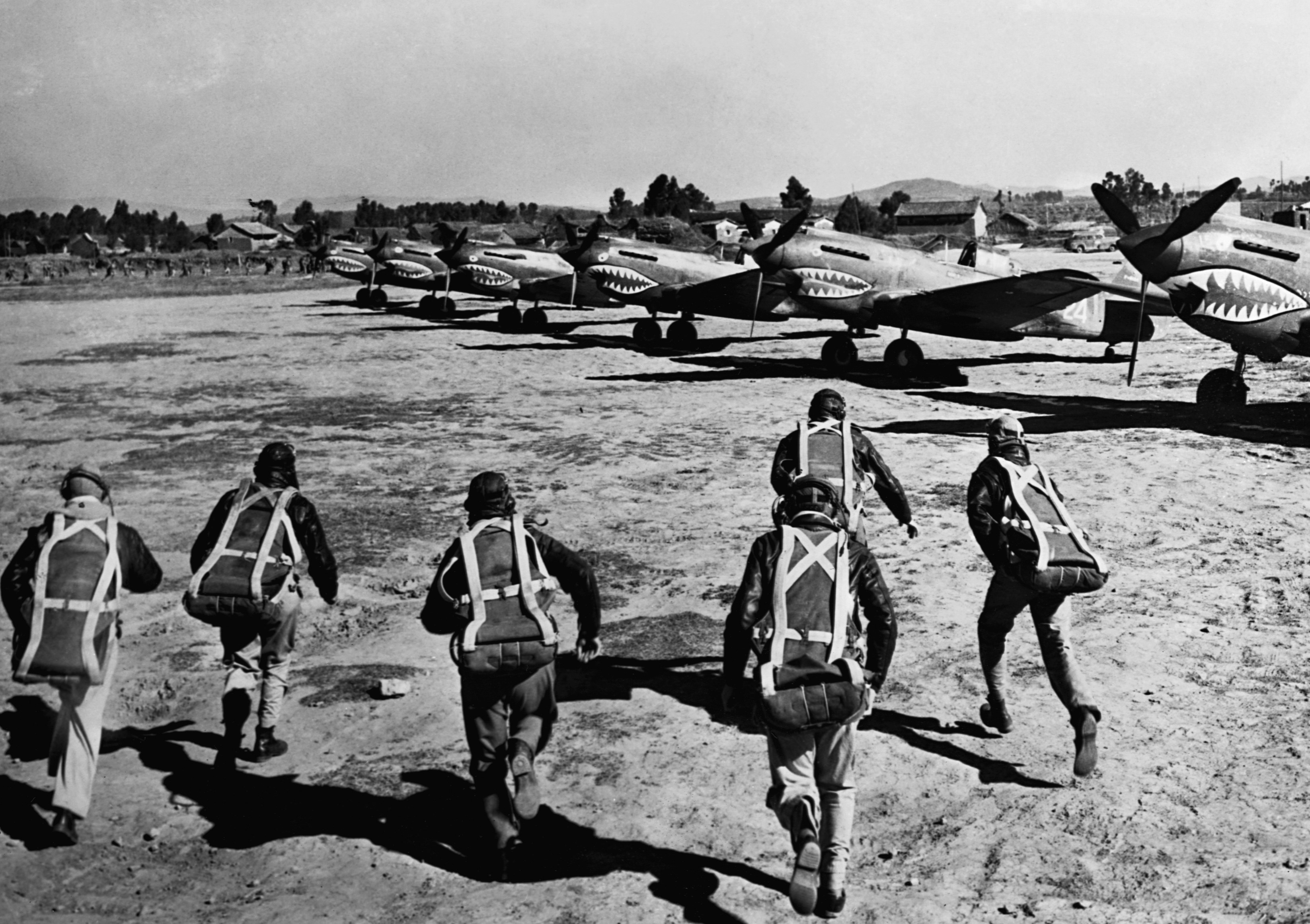 Civilian pilots of the American Volunteer Group, known as the Flying Tigers, run to their fighter planes at the sound of an air raid siren. The Flying Tigers helped to protect undermanned areas of then Nationalist-ruled China from the Japanese air force. Photo: Getty Images