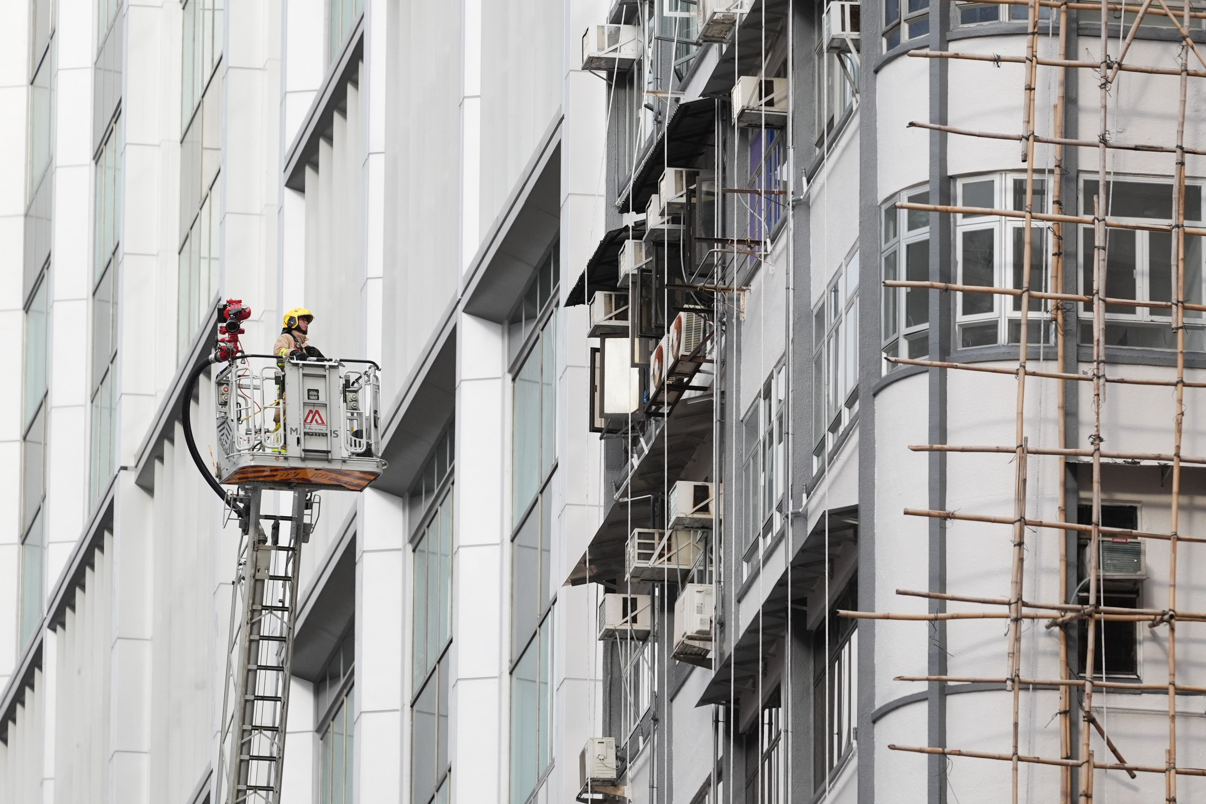 Firefighters were deployed on Saturday at the Mido Apartments in North Point when a blaze broke out. Photo: Eugene Lee