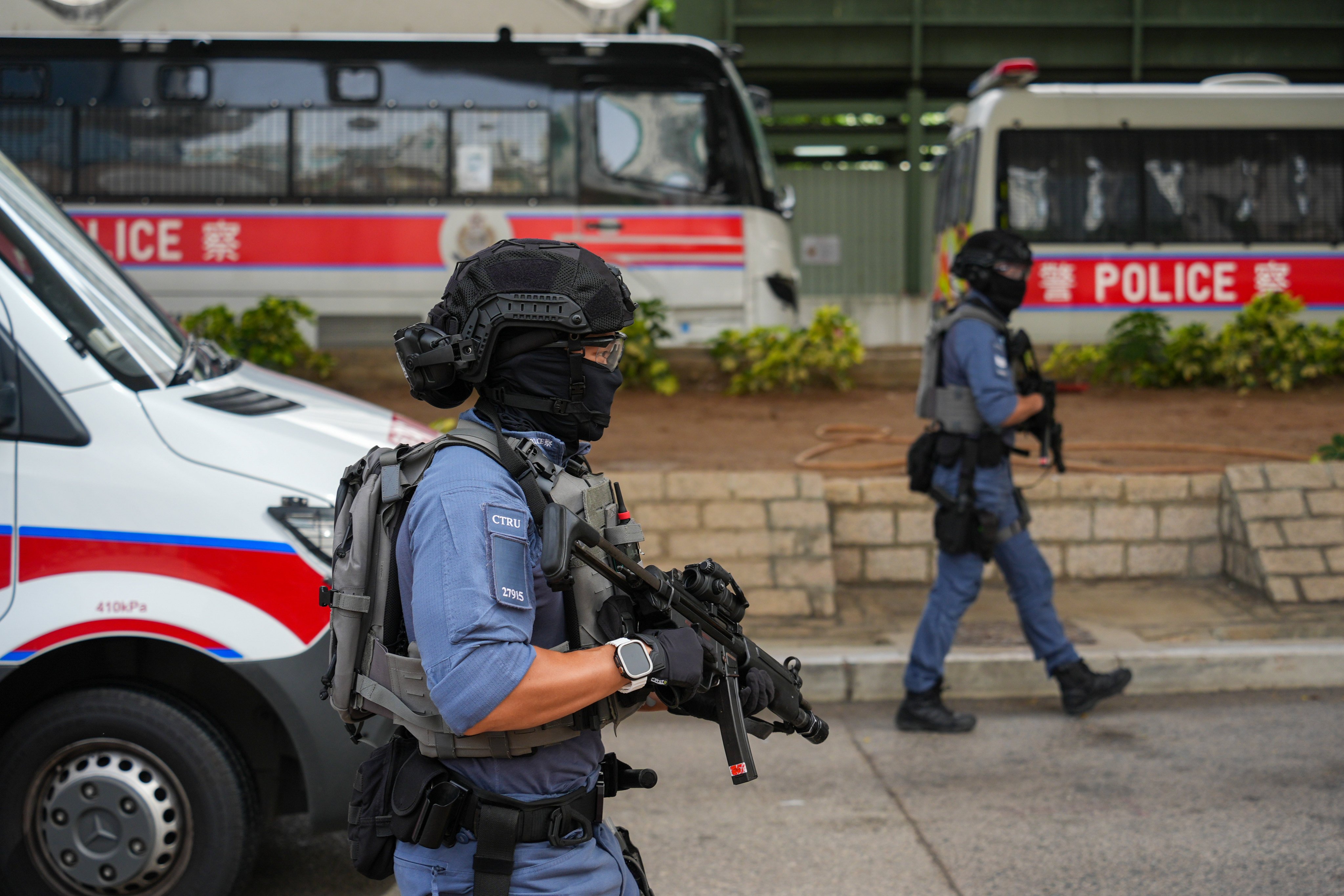 Police officers stand guard outside West Kowloon Court on Monday. Photo: Eugene Lee
