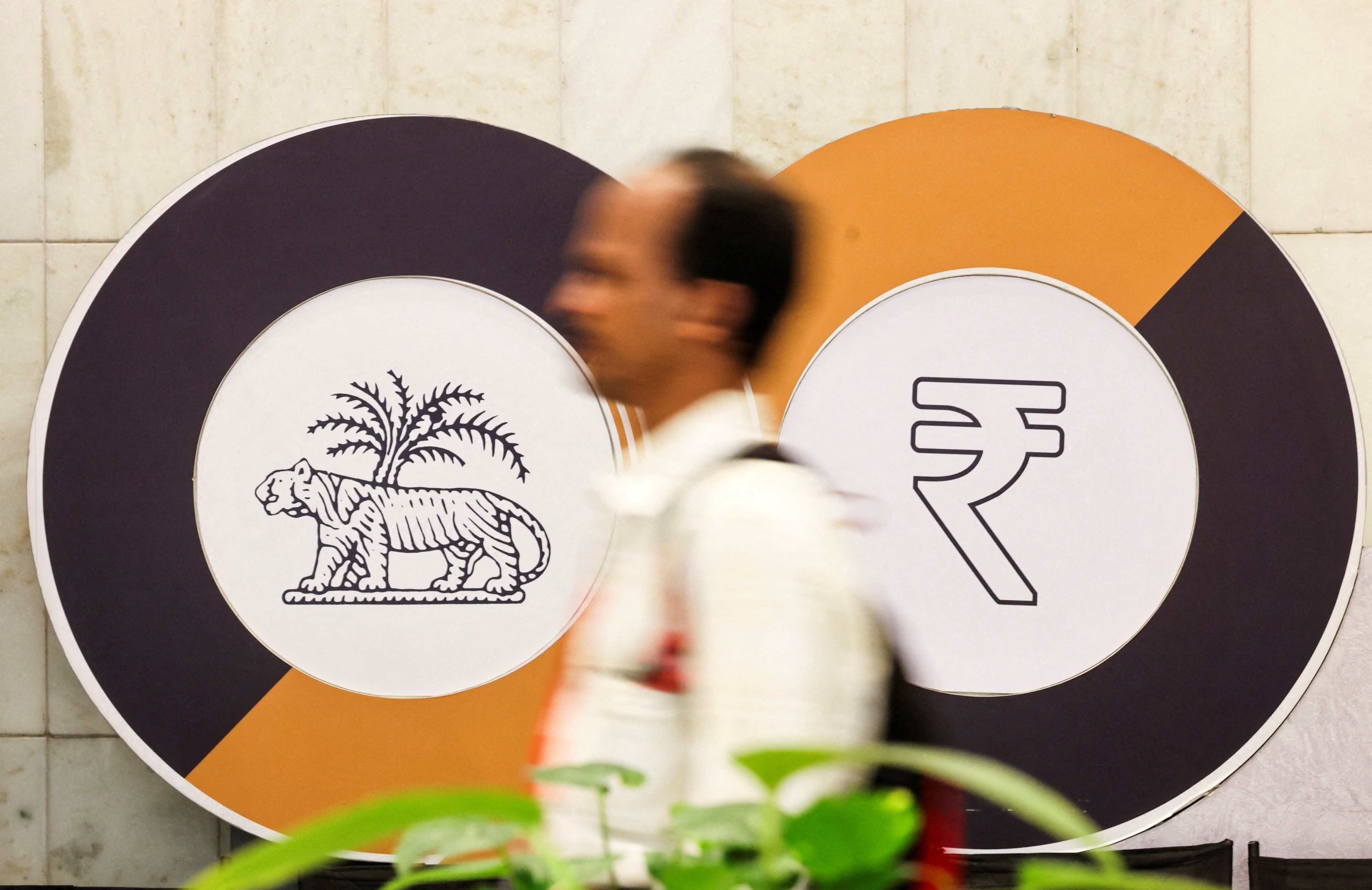 A man walks past a logo of the Reserve Bank of India inside the headquarters in Mumbai on June 12, 2024. Photo: Reuters