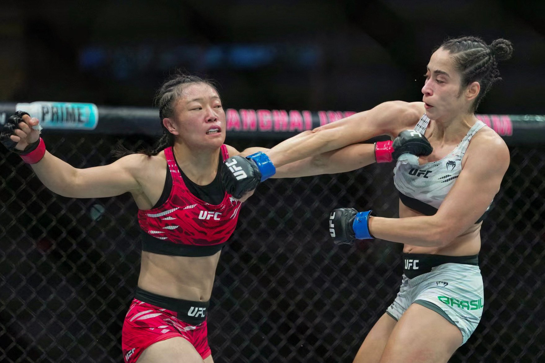China’s Shi Ming (left) lost a gruelling three-round strawweight bout against Brazil’s Bruna Brasil at UFC Fight Night in Shanghai on Friday. Photo: AFP